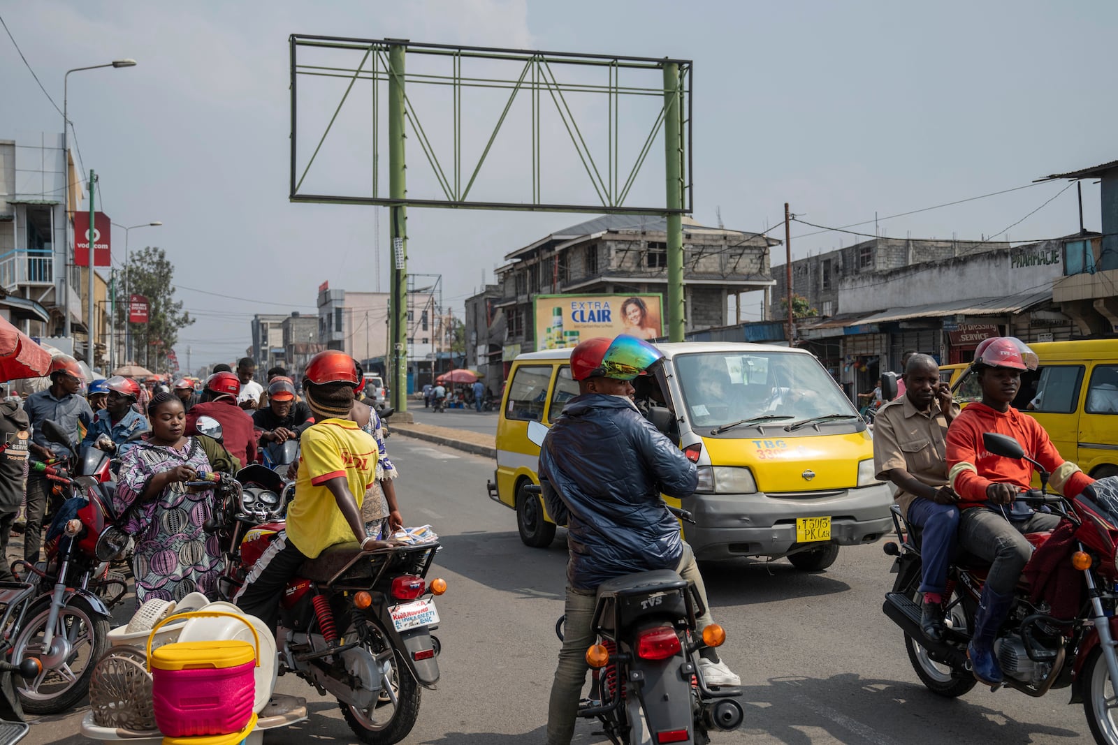 Moto taxis wait for customers in downtown Goma, Democratic Republic of Congo, Thursday, Feb. 27, 2025, one month after Rwanda-backed M23 rebels captured the city. (AP Photo/Moses Sawasawa)