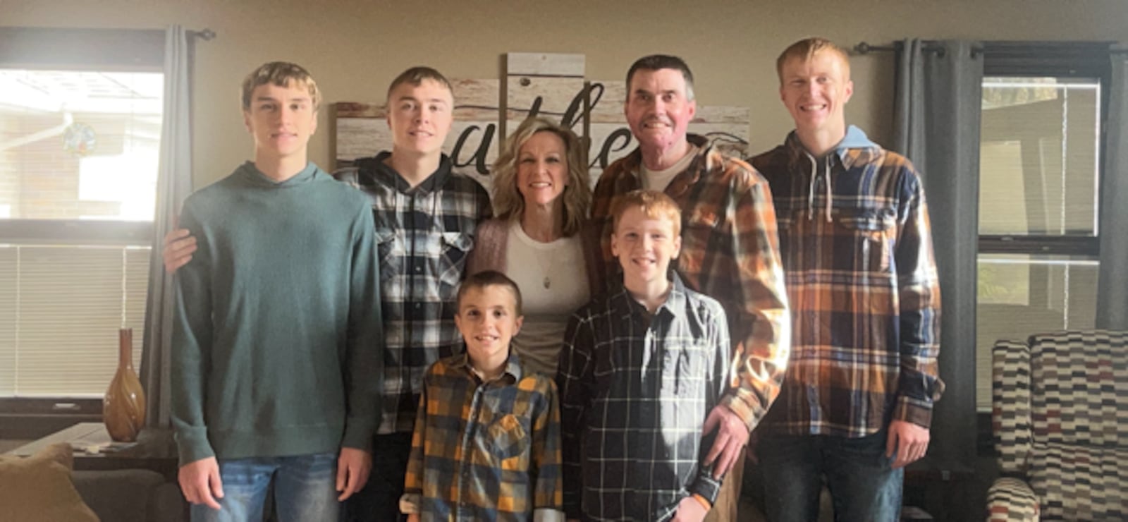 Kevin and Shelly Pleiman (middle) surrounded by their children, Anderson, Own, Quinton, Abram and Ethan, on Thanksgiving, Nov. 28, 2024, the first Thanksgiving after Kevin's accident that caused him to have severe burns on 70% of his body. COURTESY OF SHELLY PLEIMAN