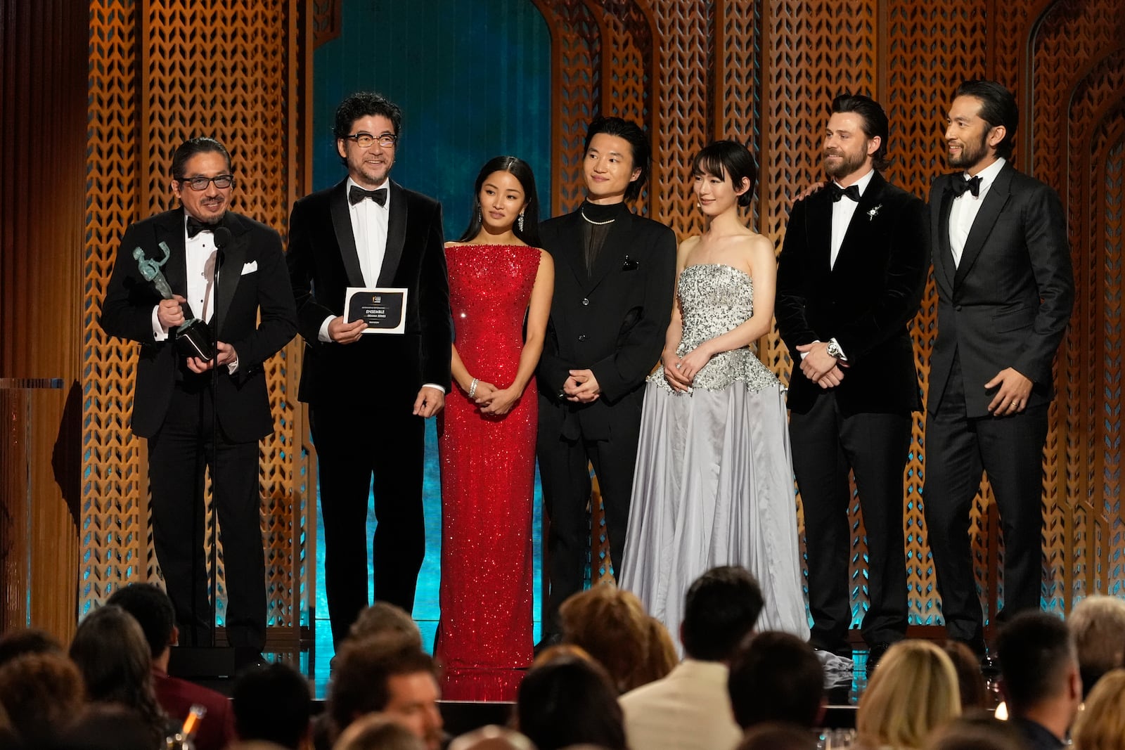 Hiroyuki Sanada, from left, Tadanobu Asano, Anna Sawai, Hiroto Kanai, Moeka Hoshi, Tommy Bastow, and Shinnosuke Abe accept the award for outstanding performance by an ensemble in a drama series for "Shogun" during the 31st annual Screen Actors Guild Awards on Sunday, Feb. 23, 2025, at the Shrine Auditorium in Los Angeles. (AP Photo/Chris Pizzello)