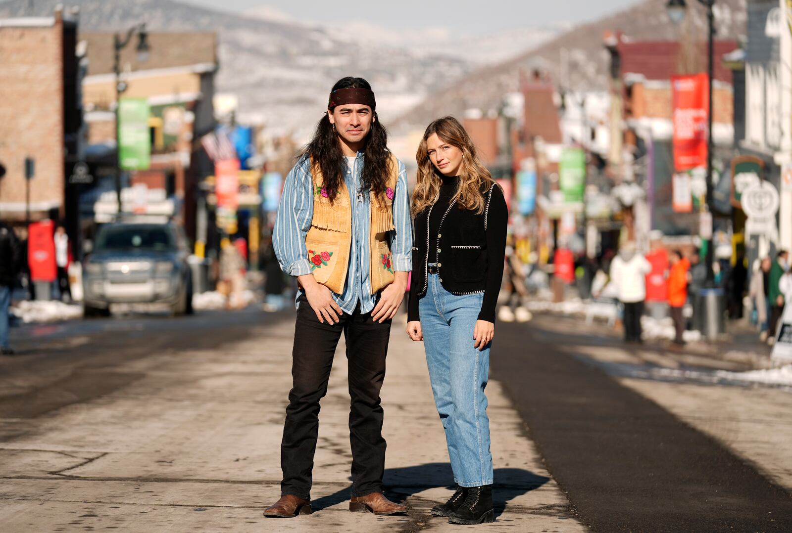 Julian Brave NoiseCat, left, and Emily Kassie, co-directors of the Oscar-nominated documentary film "Sugarcane," pose for a portrait on Main Street during the Sundance Film Festival on Monday, Jan. 27, 2025, in Park City, Utah. (AP Photo/Chris Pizzello)