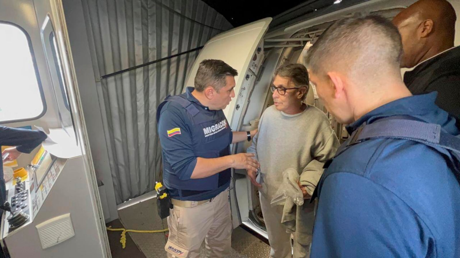 This photo released by the Colombian Immigration press office shows Colombian Fabio Ochoa, a former member of Cartel of Medellin, deplaning at the El Dorado International Airport in Bogota, Colombia, after being deported from the U.S. where he served time for drug trafficking, Monday, Dec. 23, 2024. (Colombian Immigration via AP)