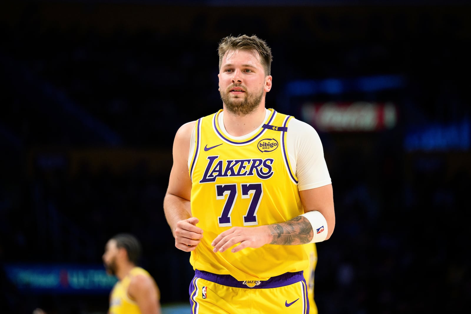 Los Angeles Lakers guard Luka Doncic (77) runs down the court during the first half of an NBA basketball game against the Charlotte Hornets, Wednesday, Feb. 19, 2025, in Los Angeles. (AP Photo/William Liang)