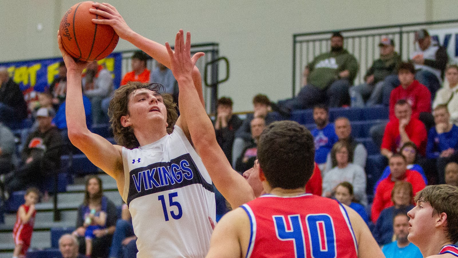 Miami East's Connor Apple shoots over Haviland Wayne Trace's Kyle Stoller at Flyin' To The Hoop on Saturday. Apple scored 11 points. Jeff Gilbert/CONTRIBUTED