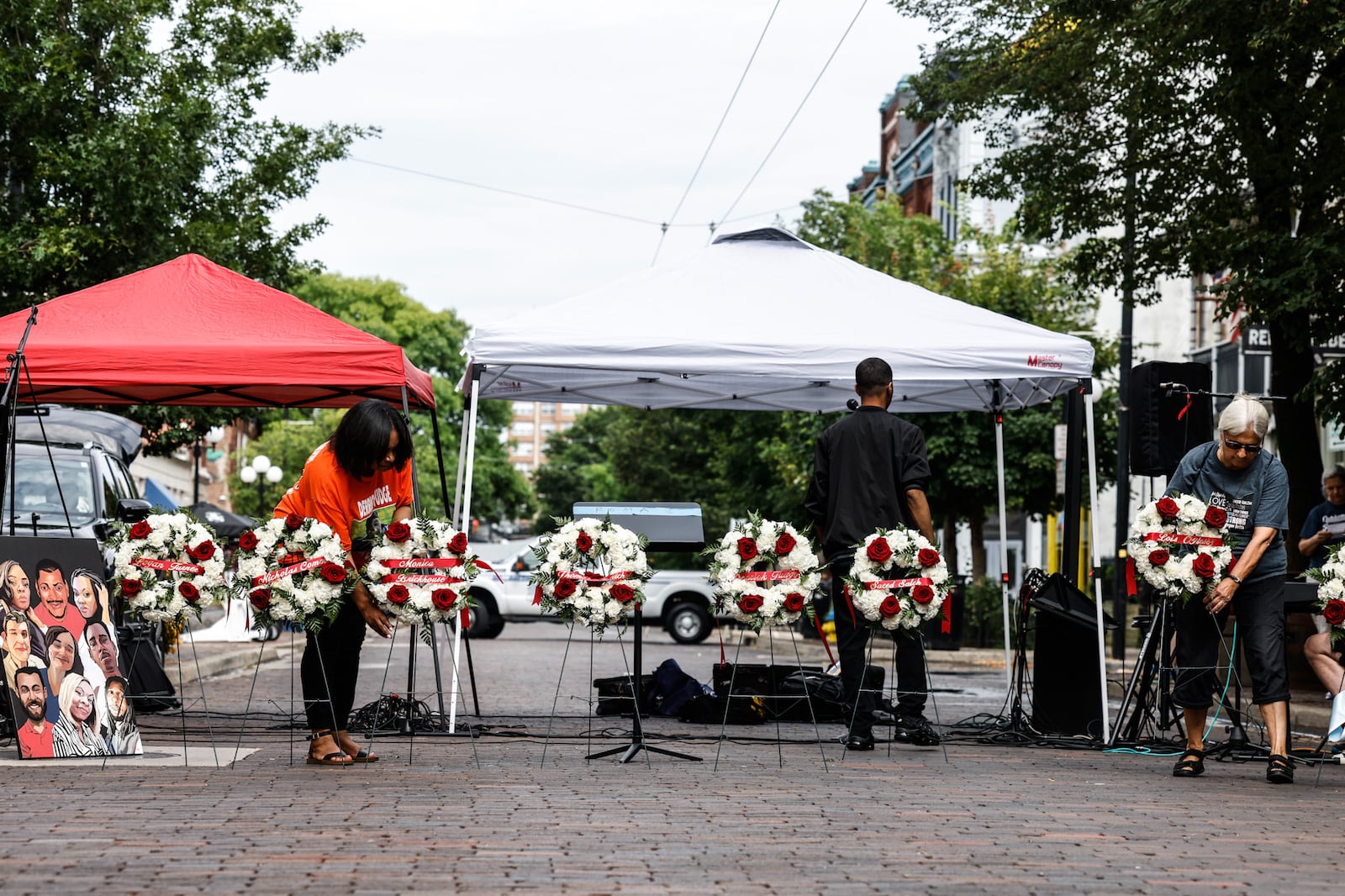 Nine wreaths are displayed, each bearing the name of one of nine victims of the Oregon District mass shooting for a remembrance event Thursday, Aug. 4, 2022, on the third anniversary of the tragedy. JIM NOELKER/STAFF