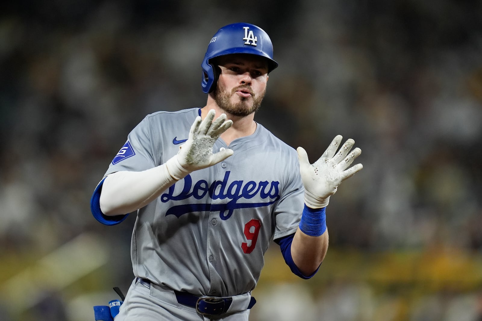 FILE - Los Angeles Dodgers' Gavin Lux celebrates as he rounds the bases after his two-run home run during the seventh inning in Game 4 of a baseball NL Division Series against the San Diego Padres, Wednesday, Oct. 9, 2024, in San Diego. (AP Photo/Gregory Bull, File)