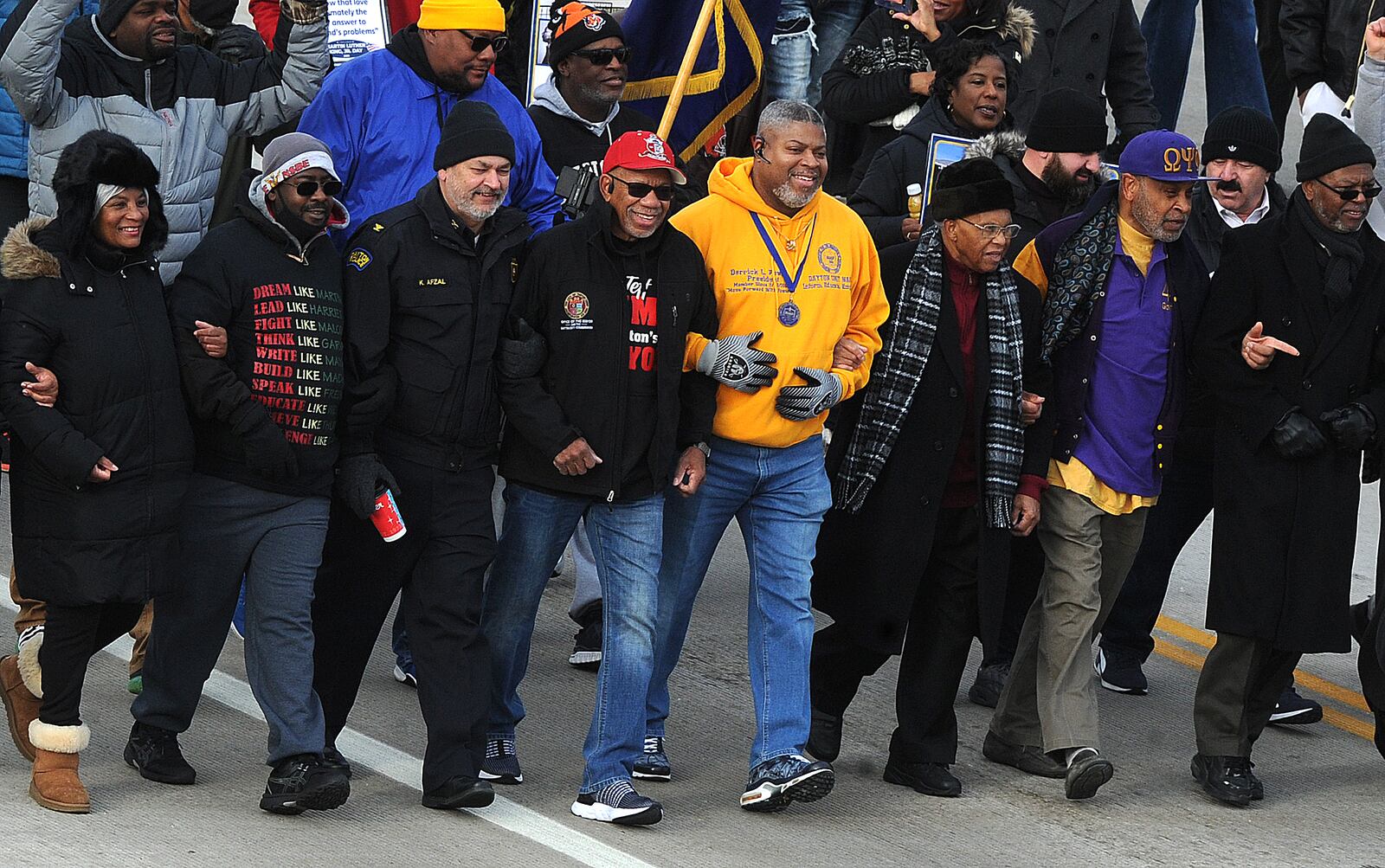 The MLK Memorial March travels over the Third Street bridge into downtown Monday Jan. 16, 2023. MARSHALL GORBY\STAFF