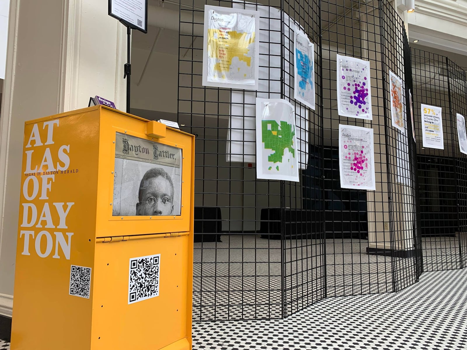 Several exhibits on display in the rotunda of the Arcade during the Imagining Community Symposium examine and map the disparities between majority-white and non-white communities, including in education and housing.