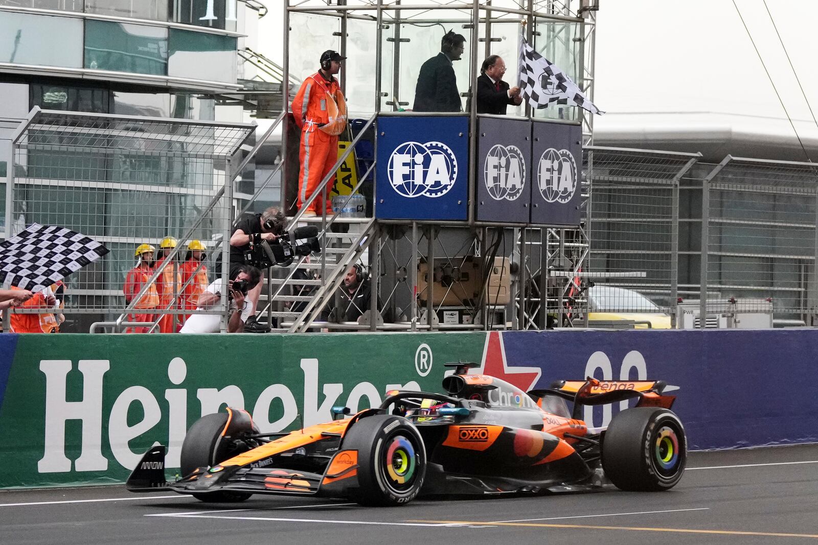 McLaren driver Oscar Piastri of Australia crosses the finish line to win the Chinese Formula One Grand Prix race at the Shanghai International Circuit, Shanghai, Sunday, March 23, 2025. (AP Photo)