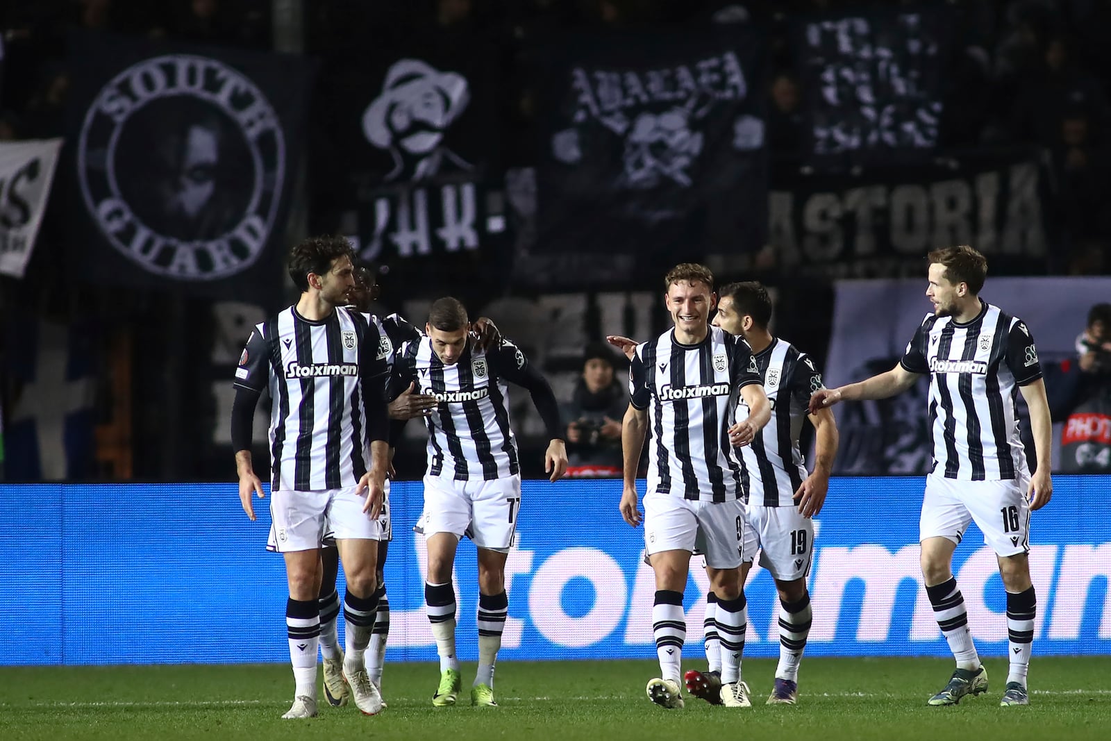 PAOK players celebrate a goal against Ferencvaros during the Europa League opening phase soccer match between PAOK and Ferencvaros at Toumpa stadium, in Thessaloniki, Greece, Thursday, Dec. 12, 2024. (AP Photo/Giannis Papanikos)