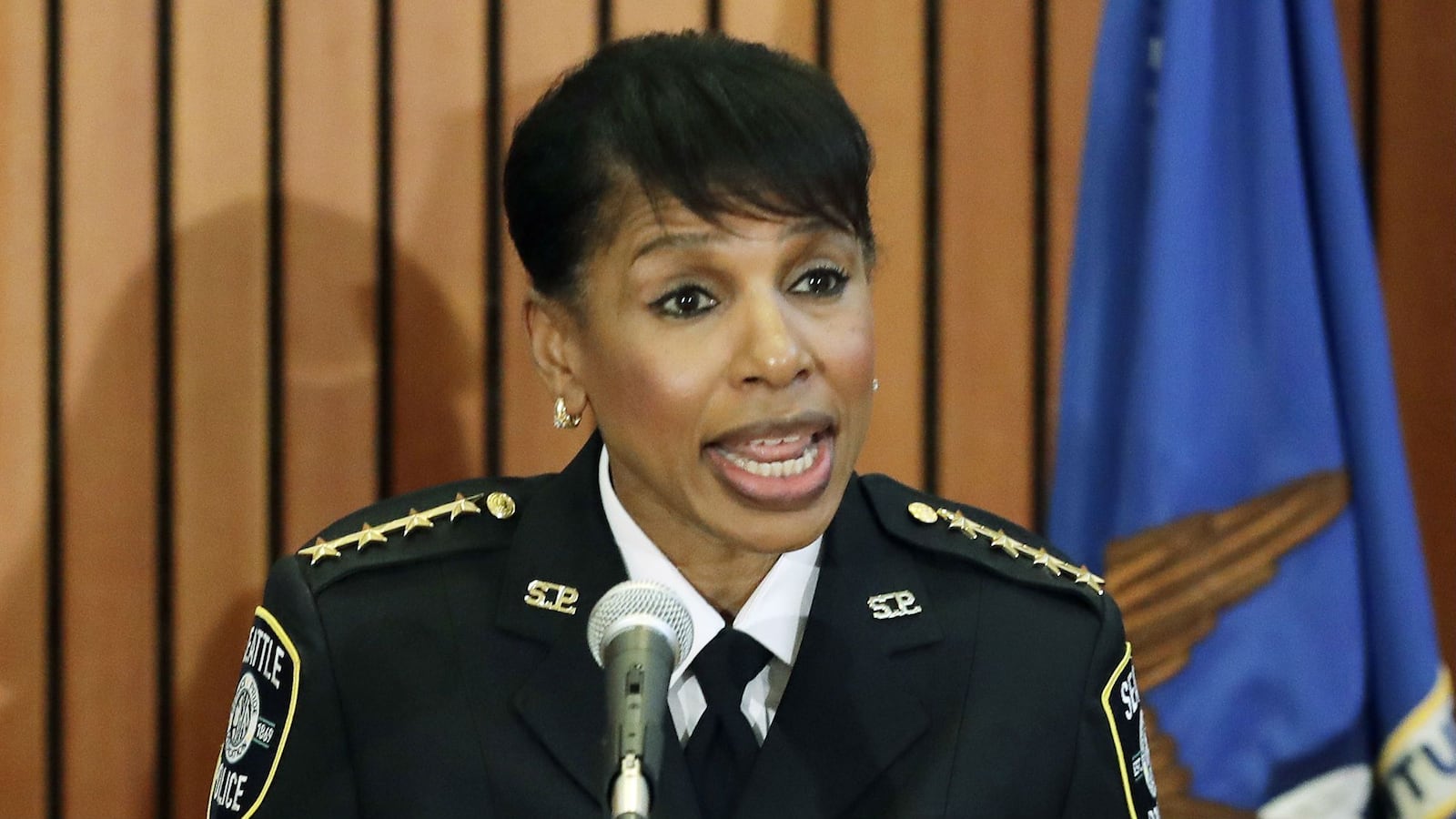 Seattle police Chief Carmen Best speaks at a June 2018 news conference in Kent, Wash. A Seattle police officer has been suspended for six days following an investigation into a May 2018 ruse that investigators say caused a hit-and-run suspect to kill himself. 