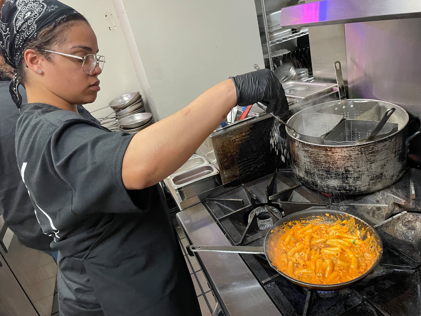 Corner Kitchen is located at 613 E. Fifth St. in Dayton’s Oregon District. Pictured is sous chef Blessing Henderson. NATALIE JONES/STAFF