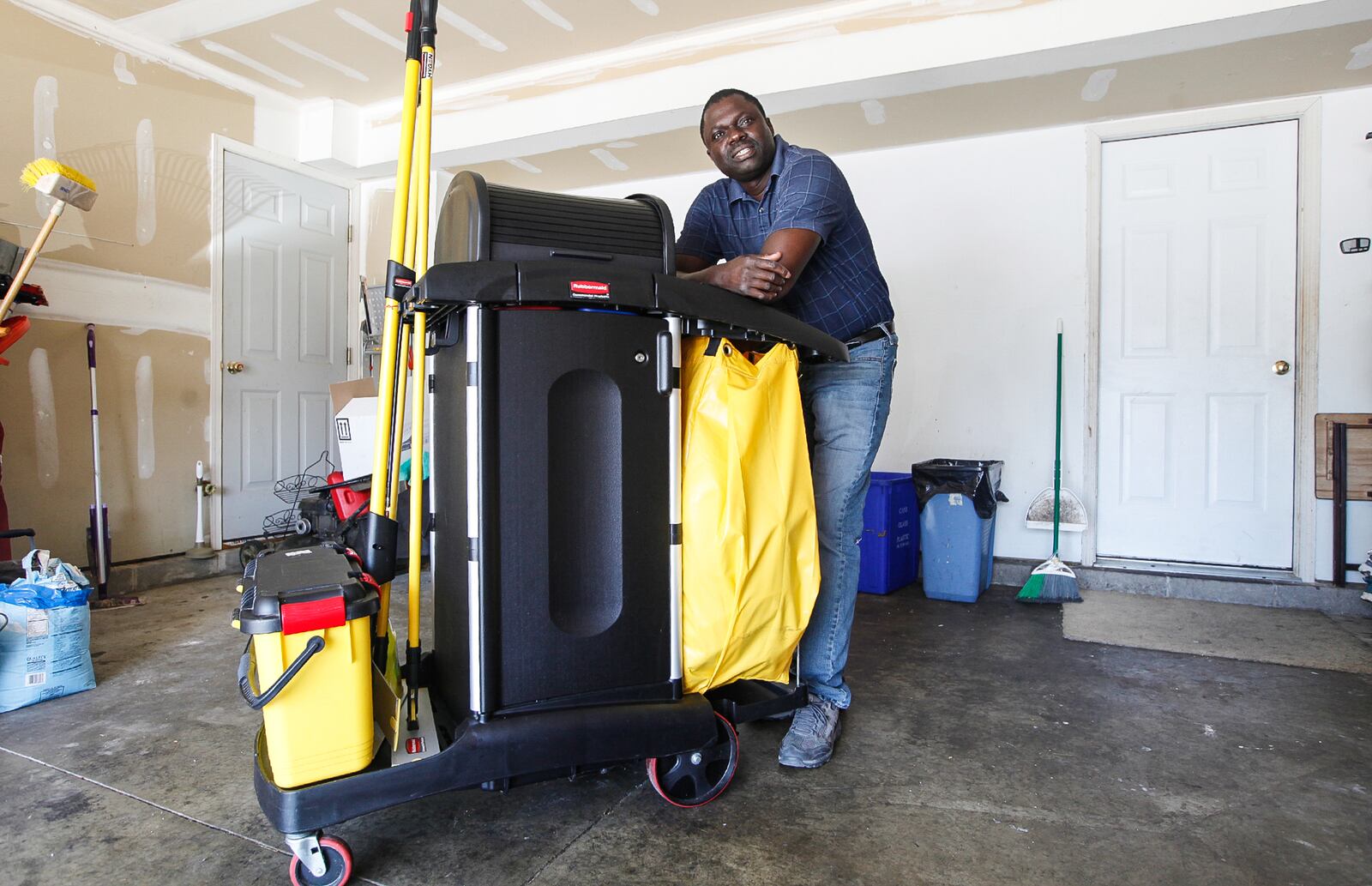 Omar Mbengue, pictured, and his wife, Ndeye, have a family-owned small business, Relaxa Cleaning Services. The company was among the first recipients of coronavirus relief small business grants distributed by the Montgomery County Office of CARES Act. CHRIS STEWART / STAFF