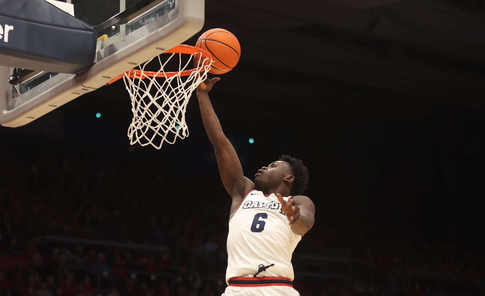 Dayton's Enoch Cheeks scores against Duquesne on Tuesday, Feb. 13, 2024, at UD Arena. David Jablonski/Staff