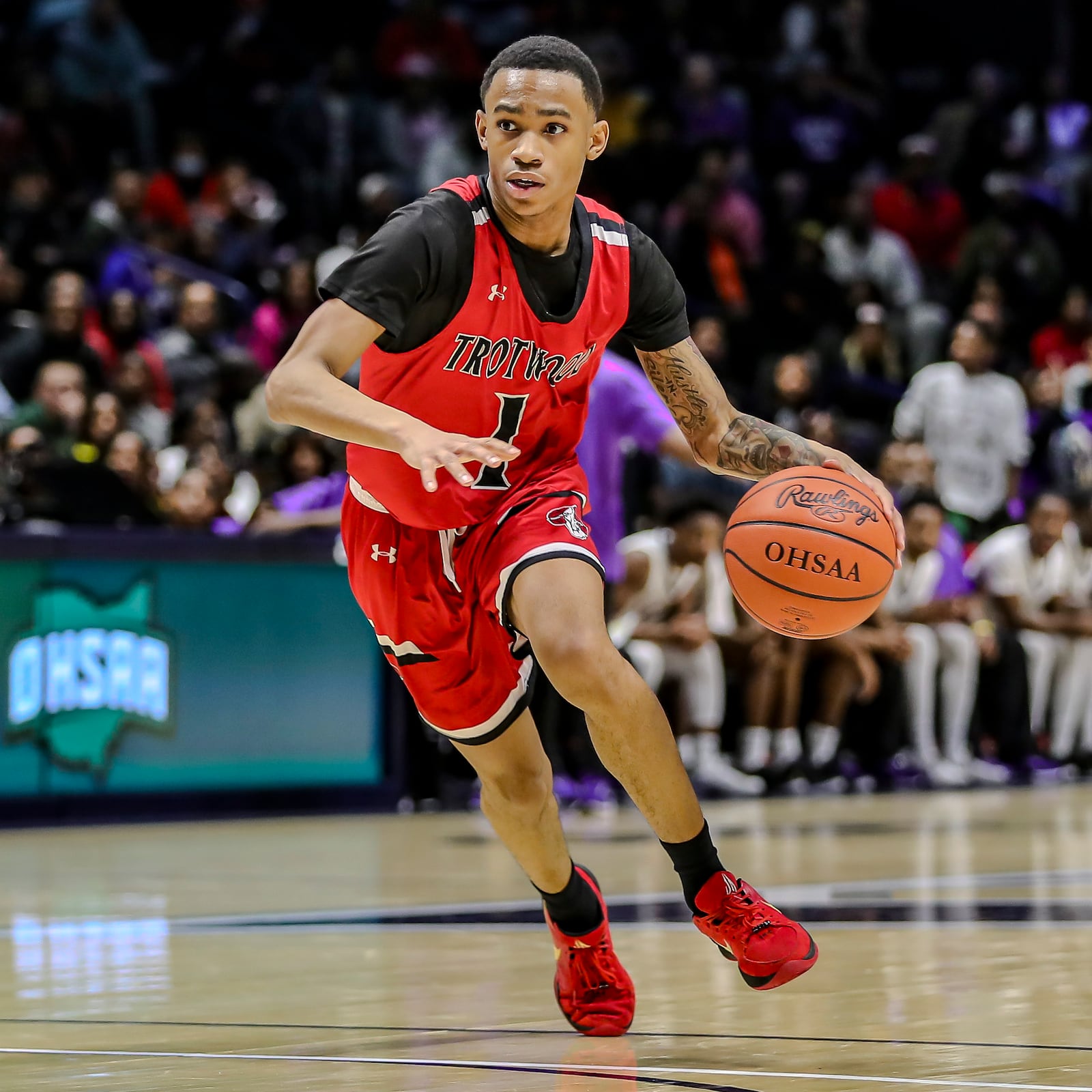 Trotwood Madison High School senior Giovannis Barber dribbles the ball during their Division III regional final game against Cincinnati Aiken on Sunday afternoon at the Xavier University Cintas Center. Aiken won 71-50. Michael Cooper/STAFF