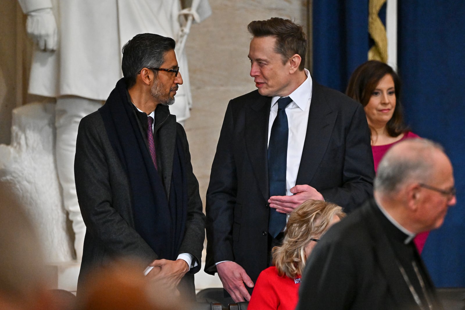 Google CEO Sundar Pichai and Elon Musk arrive before the 60th Presidential Inauguration in the Rotunda of the U.S. Capitol in Washington, Monday, Jan. 20, 2025. (Ricky Carioti/The Washington Post via AP, Pool)