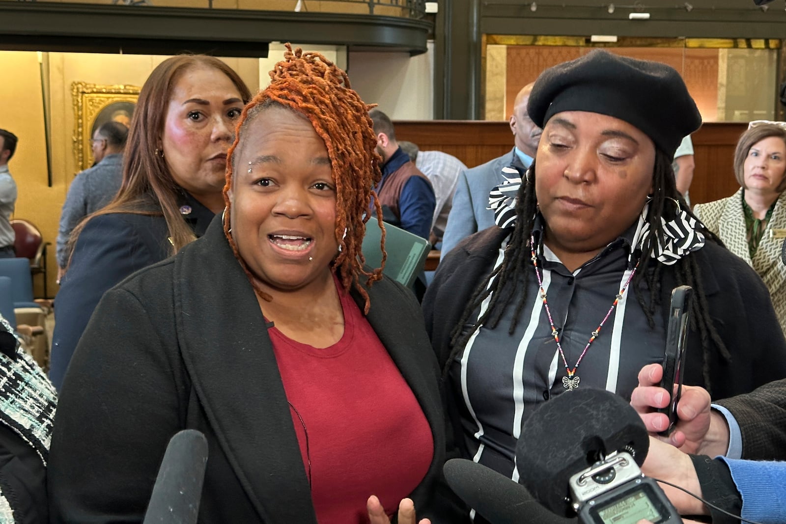 Breonna Taylor's mother, Tamika Palmer, left, discusses the consent decree the U.S. Justice Department reached with the city of Louisville on Thursday, Dec. 12, 2024. (AP Photo/Dylan Lovan)