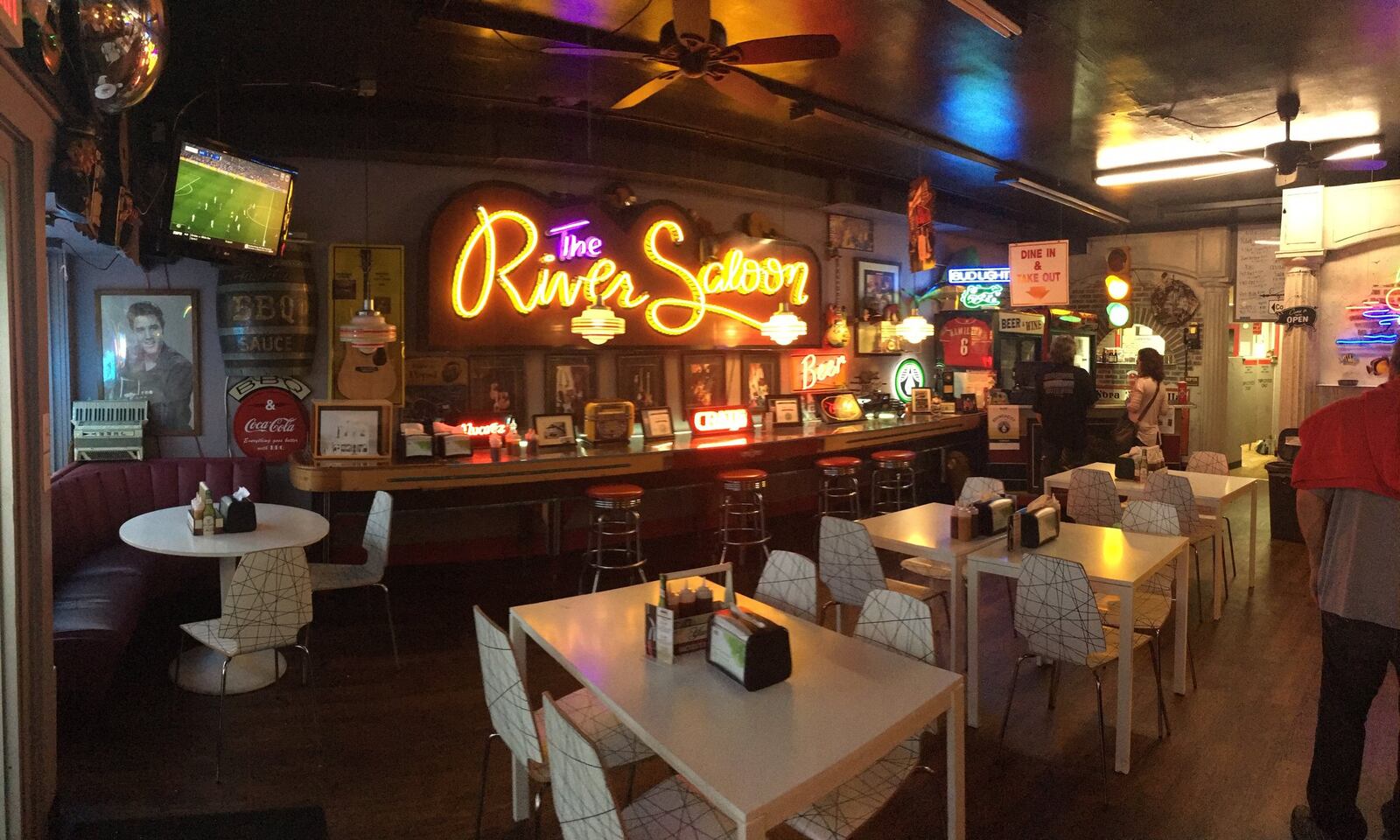 Customers unfamiliar with Combs BBQ in Middletown are attracted by the neon signs, but quickly learn the restaurant serves up delicious food.  ALEXIS LARSEN/CONTRIBUTED