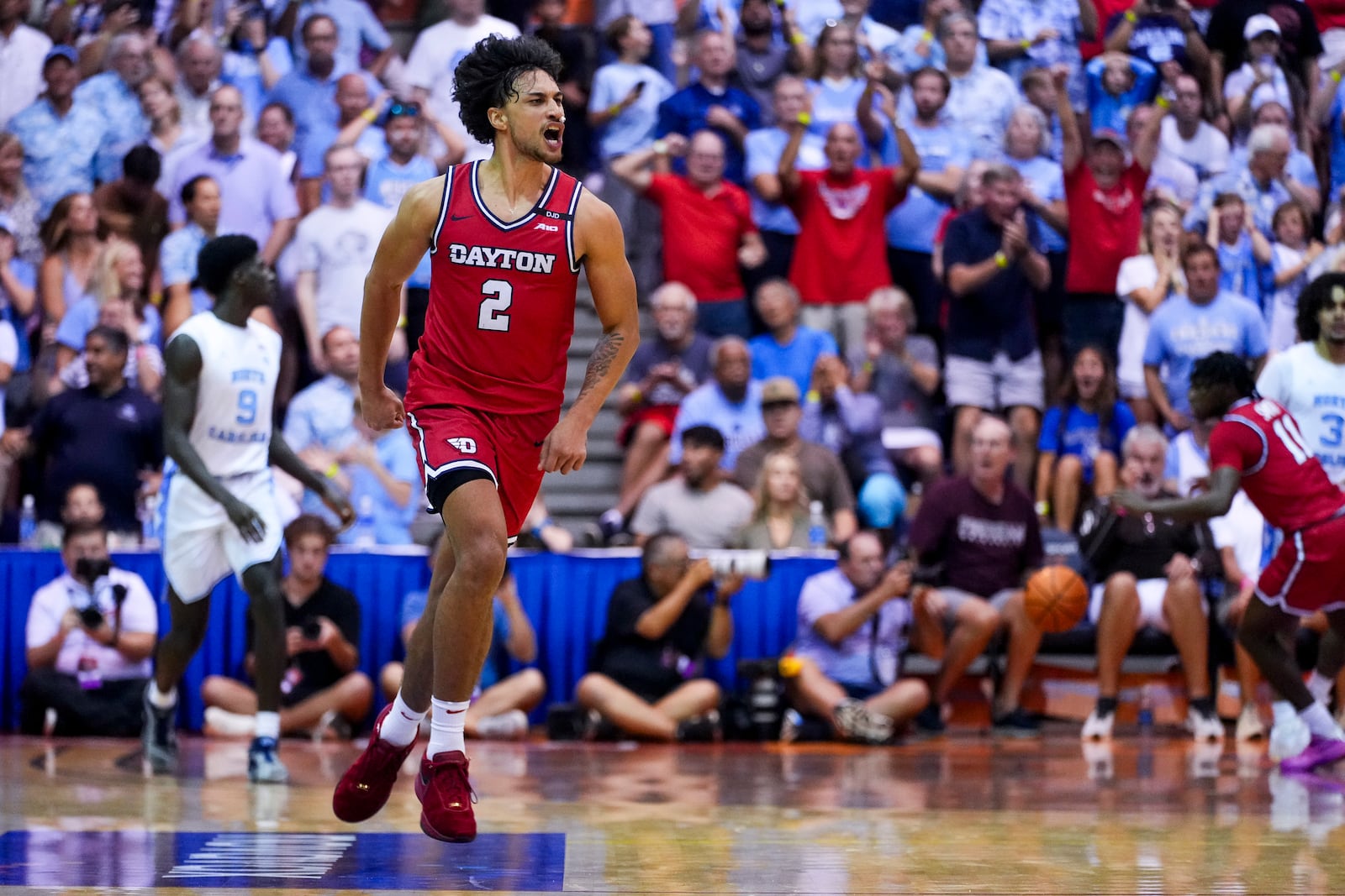 Dayton forward Nate Santos (2) reacts after tying the game against North Carolina during the second half of an NCAA college basketball game at the Maui Invitational Monday, Nov. 25, 2024, in Lahaina, Hawaii. (AP Photo/Lindsey Wasson)