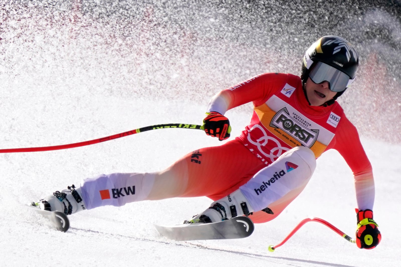 Switzerland's Lara Gut Behrami speeds down the course of an alpine ski, women's World Cup super G race, in La Thuile, Italy, Thursday, March 13, 2025. (AP Photo/Piermarco Tacca)