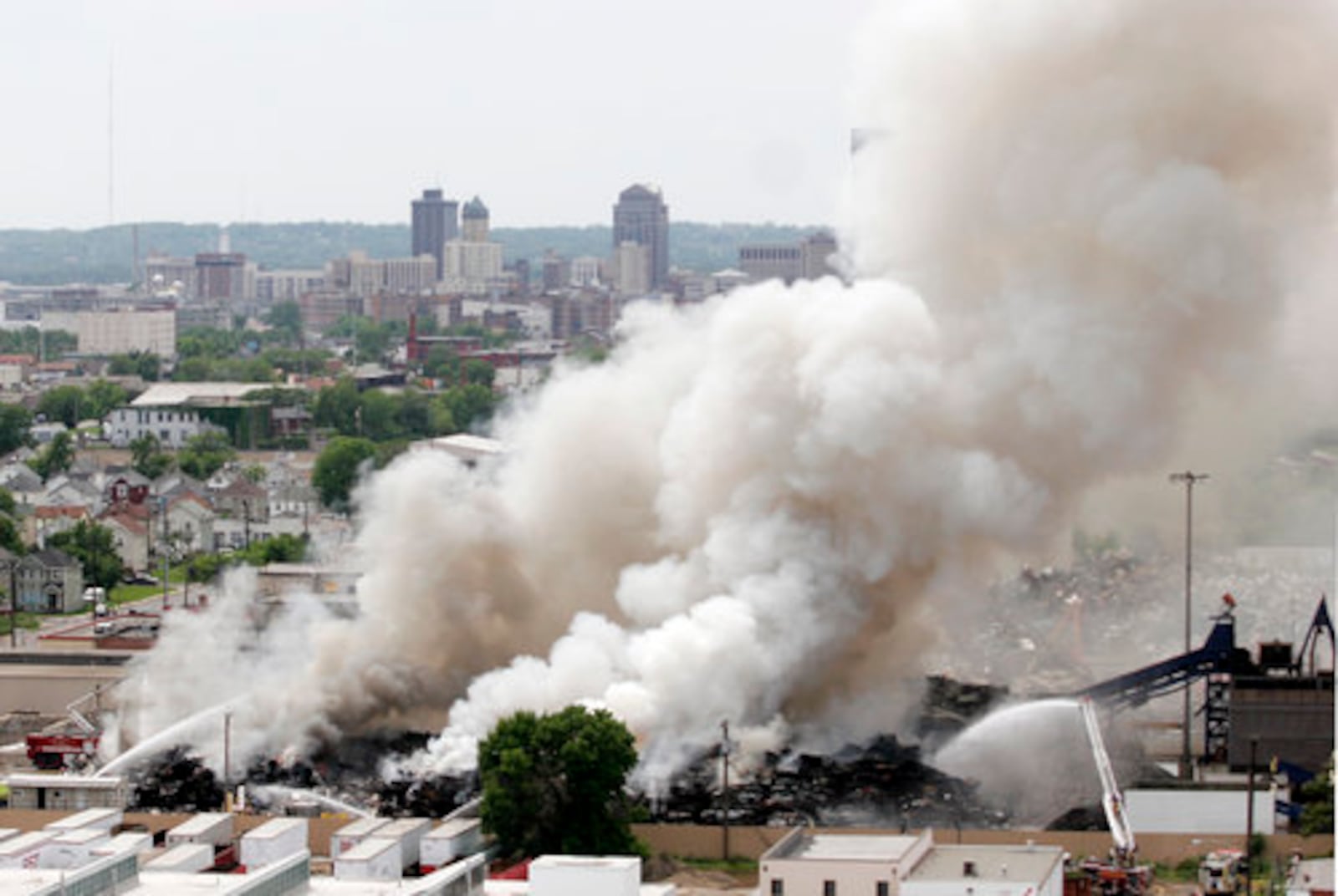 A pile of 3,000 scrap autos and appliances burns Thursday, May 20, 2010, at Franklin Iron and Metal, 2015 E. First St. in Dayton. CHRIS STEWART / STAFF