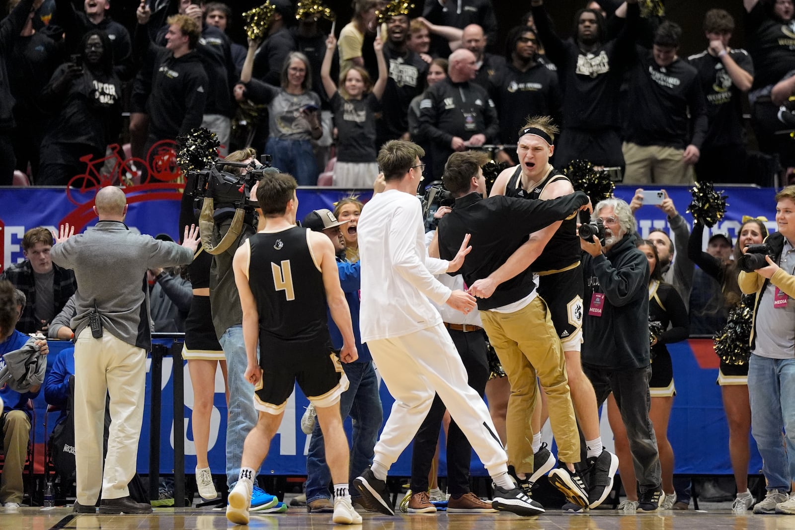 Wofford center Kyler Filewich celebrates after their win against Furman in a college basketball championship game at the Southern Conference tournament, Monday, March 10, 2025, in Asheville, N.C. (AP Photo/Chris Carlson)