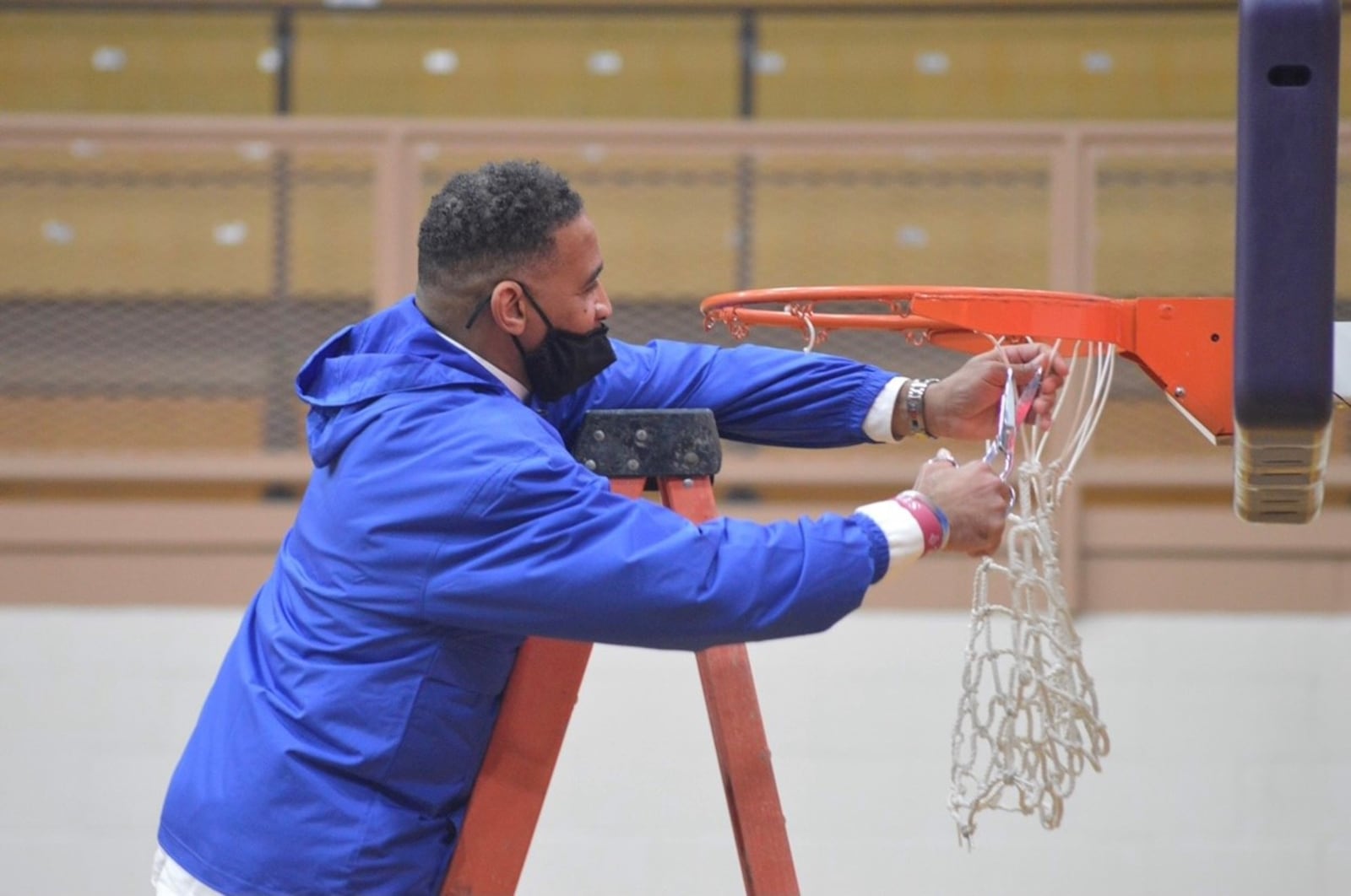 Rich Kidd cutting down the nets after a Chaminade Julienne victory in the Division II regional. CONTRIBUTED