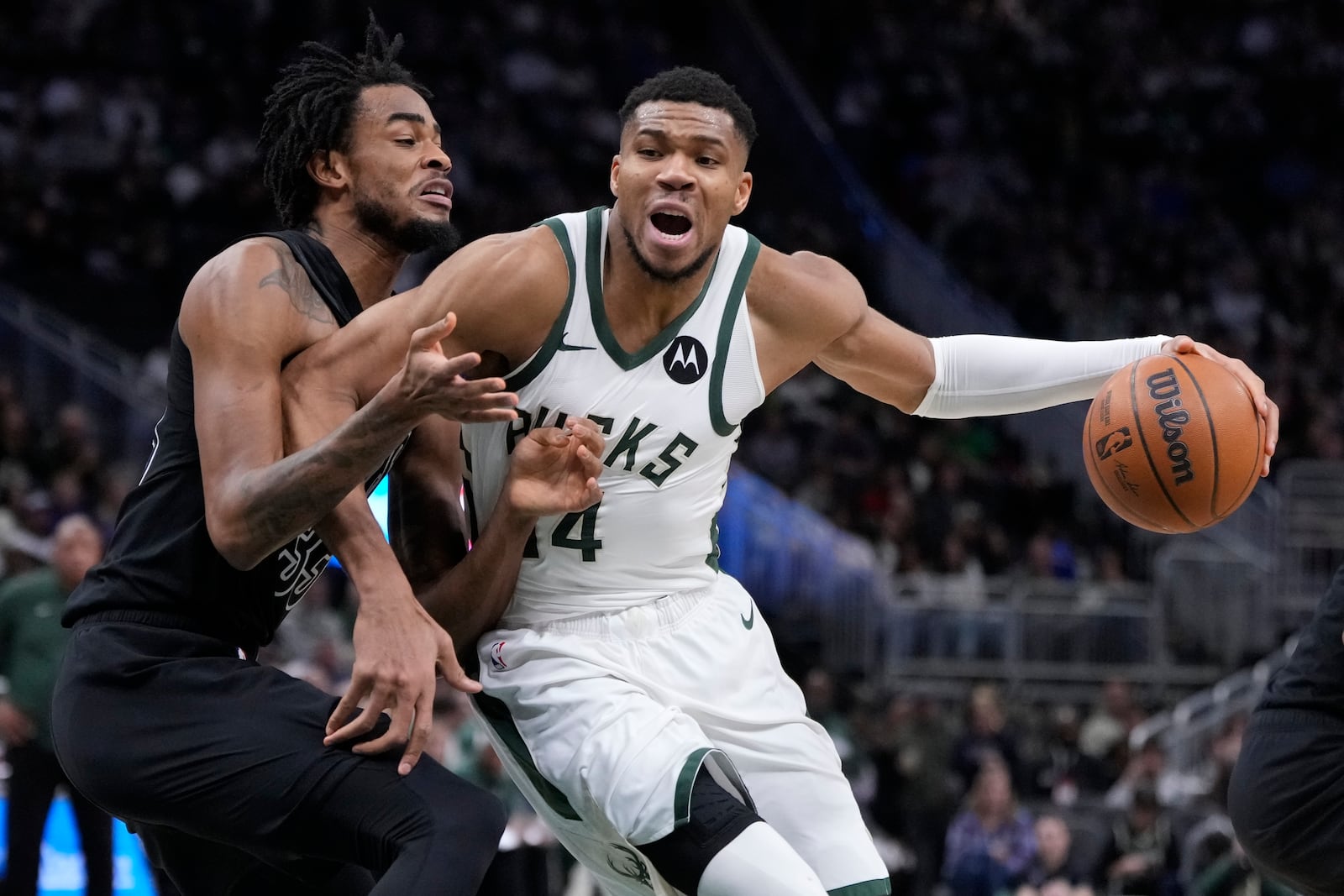 Milwaukee Bucks' Giannis Antetokounmpo tries to get past Brooklyn Nets' Nic Claxton during the second half of an NBA basketball game Thursday, Jan. 2, 2025, in Milwaukee. (AP Photo/Morry Gash)