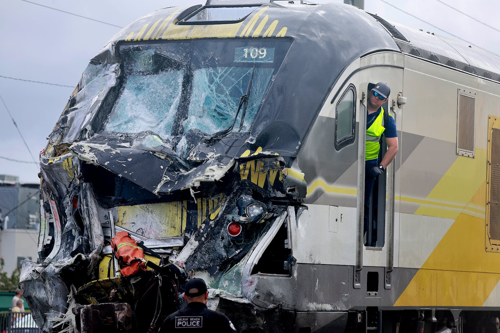 A damaged Brightline train is seen after it collided with a fire truck in downtown Delray Beach, Fla., Saturday, Dec. 28, 2024. (Mike Stocker/South Florida Sun-Sentinel via AP)