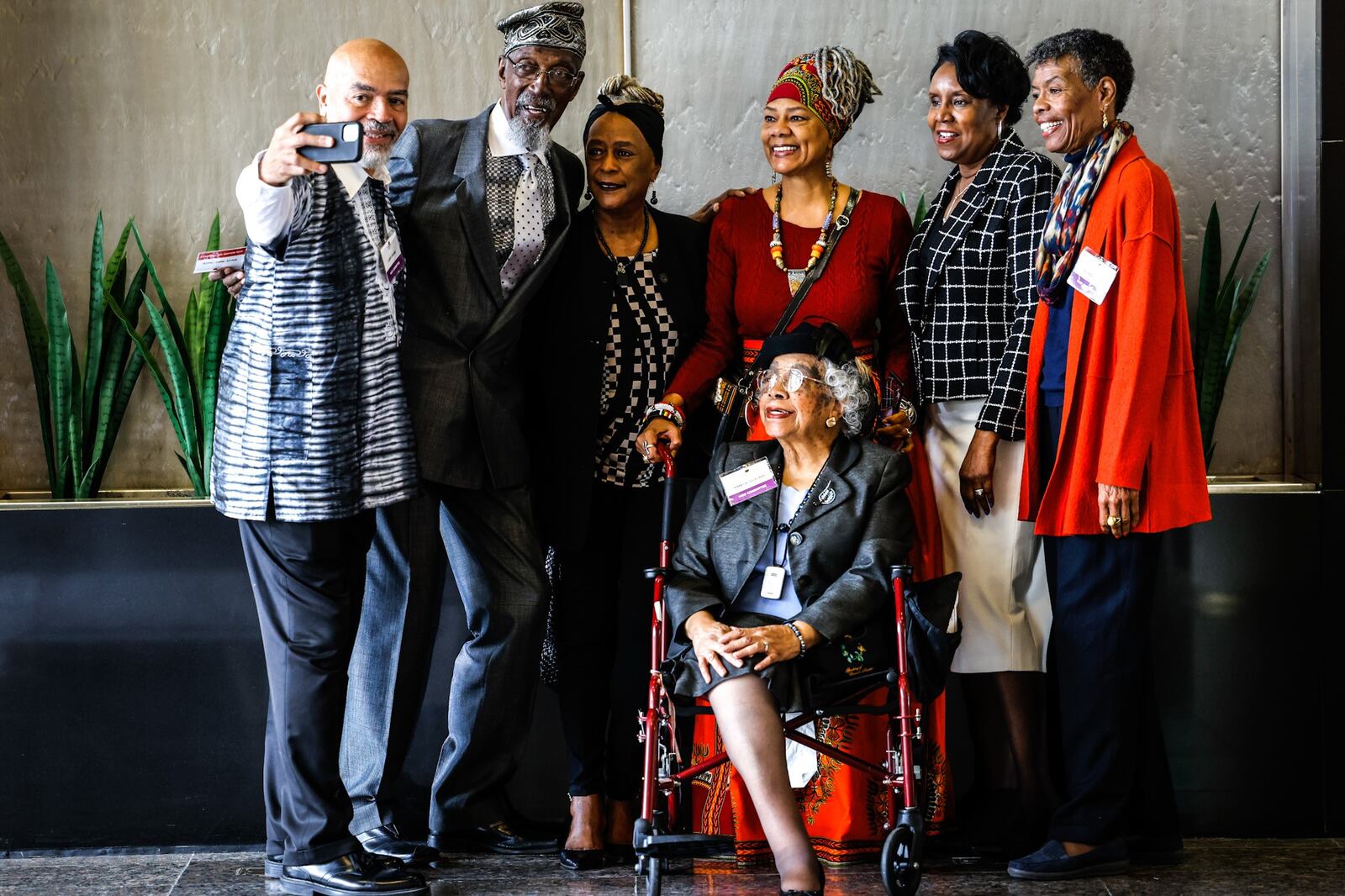 Larry Crowe takes a selfie with members of Wright Dunbar Inc. before the 2022 Dayton Region Walk of Fame inductee luncheon held Wednesday October at Sinclair Community College. About 400 people attended the yearly event. JIM NOELKER/STAFF