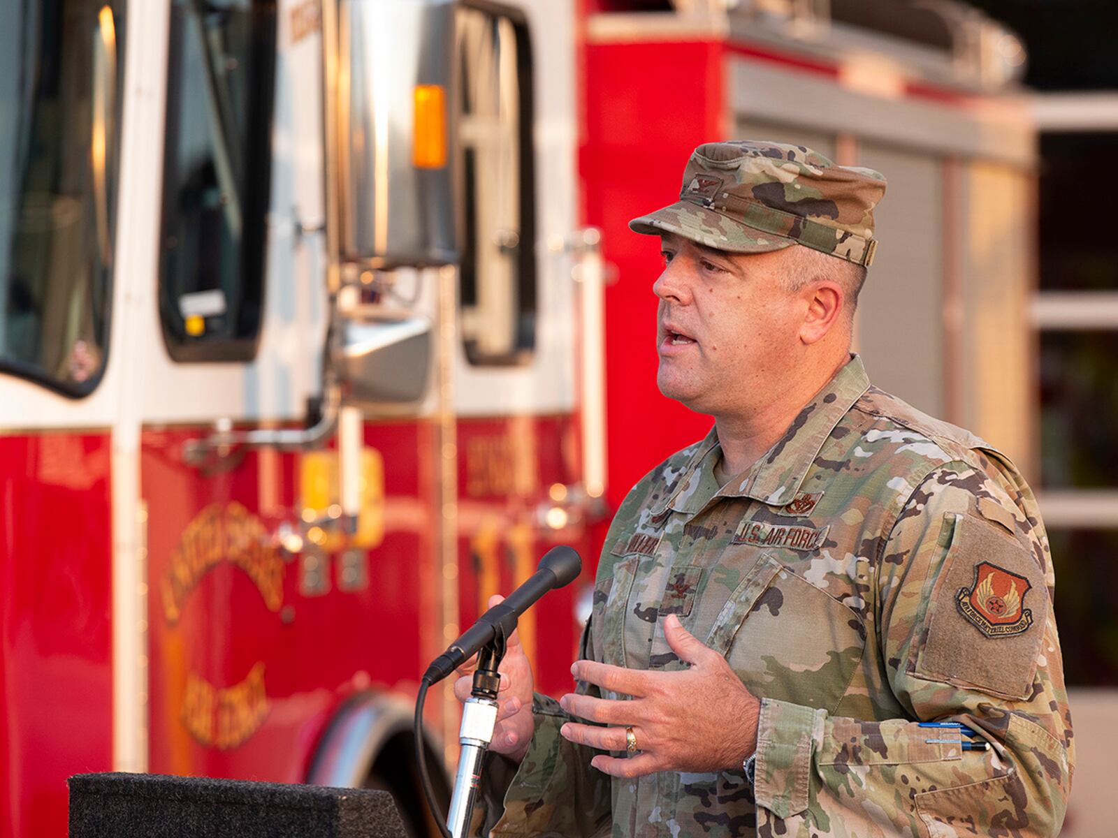 Col. Patrick Miller, 88th Air Base Wing and installation commander, delivers remarks during the 9/11 commemoration ceremony Sept. 10 in front of the main firehouse at Wright-Patterson Air Force Base. He praised heroics of the first responders that day and how they continue to inspire. U.S. AIR FORCE PHOTO/R.J. ORIEZ