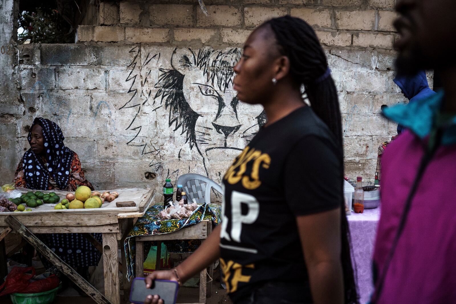 A lion is drawn on the wall of a market in Dakar, Senegal, on Friday, Jan. 17, 2025. (AP Photo/Annika Hammerschlag)