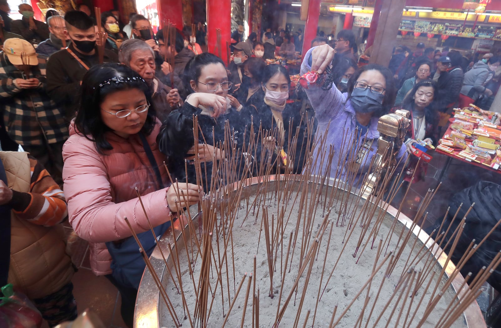 Worshippers visit a temple to pray on the first day of the Lunar New Year celebrations in Taipei, Taiwan, Wednesday, Jan. 29, 2025. (AP Photo/Chiang Ying-ying)