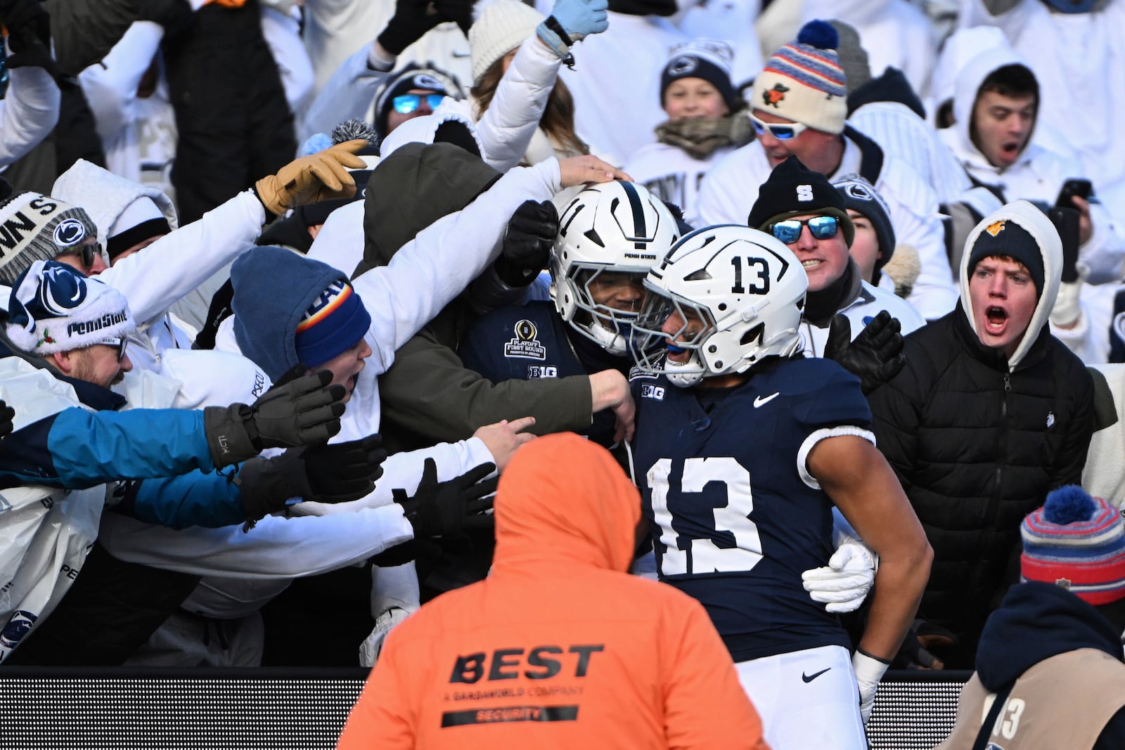 Penn State linebacker Tony Rojas celebrates an interception for a touchdown with Abdul Carter against SMU during the first half in the first round of the NCAA College Football Playoff, Saturday, Dec. 21, 2024, in State College, Pa. (AP Photo/Barry Reeger)