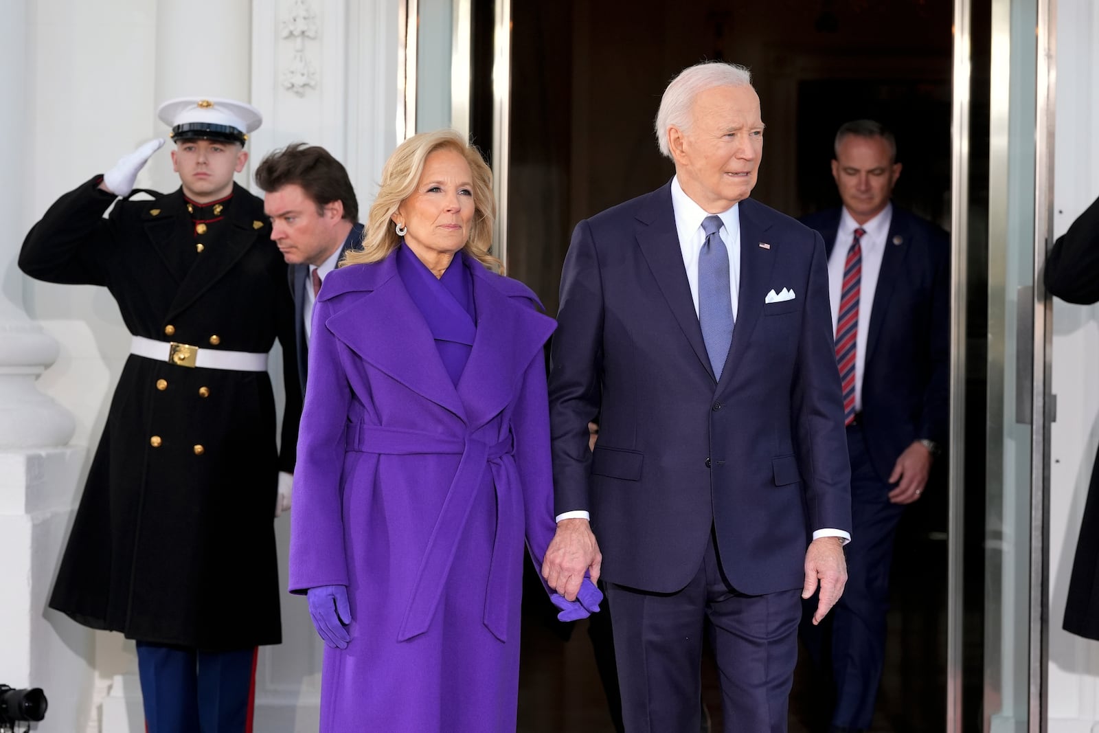 President Joe Biden and first lady Jill Biden walk out to greet Vice President Kamala Harris and second gentleman Doug Emhoff upon their arrival at the White House, Monday, Jan. 20, 2025, in Washington. (AP Photo/Alex Brandon)