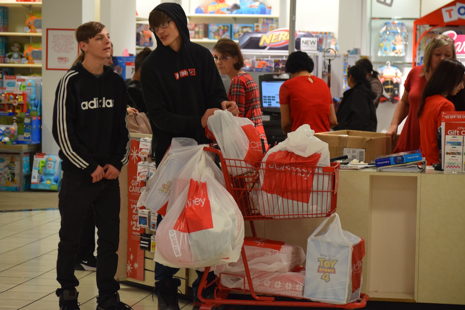 PHOTOS: Hundreds like up outside JCPenney for doorbusters, coupons