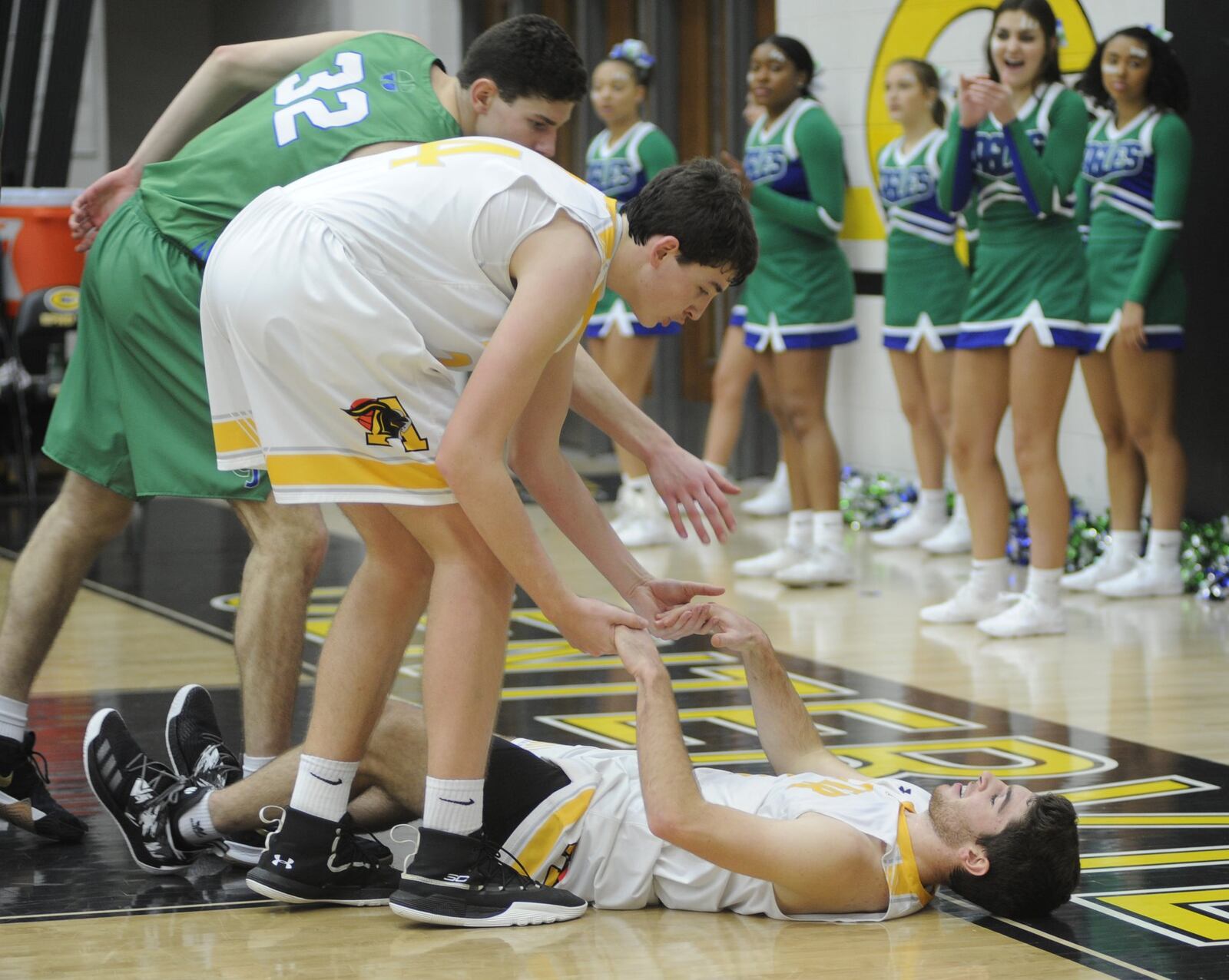 Dominic Ruffolo of Alter (right) gets a helping hand from teammate Conor Stolly and Daniel Nauseef of CJ. Chaminade Julienne defeat Alter 63-58 in a boys high school basketball game at Centerville on Sunday, Dec. 16, 2018. MARC PENDLETON / STAFF