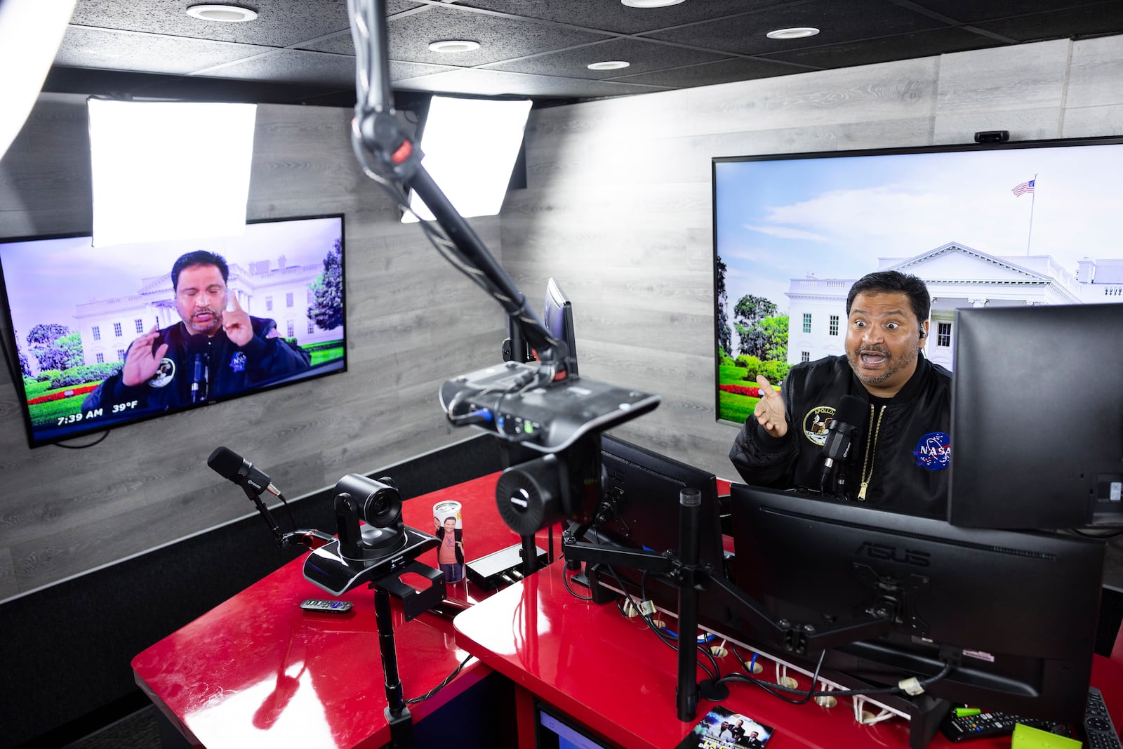 Radio host and owner of radio station La Mega 101.7 FM Victor Martinez on the air in Allentown, Pa., Tuesday, Oct. 15, 2024. (AP Photo/Ryan Collerd)