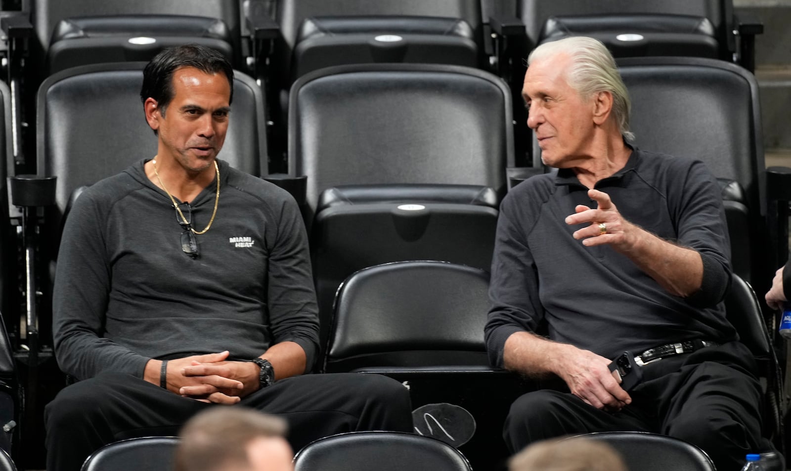 Miami Heat head coach Erik Spoelstra, left, chats with team president Pat Riley as they watch players practice for Game 2 of the NBA Finals, June 3, 2023, in Denver. (AP Photo/David Zalubowski, file)