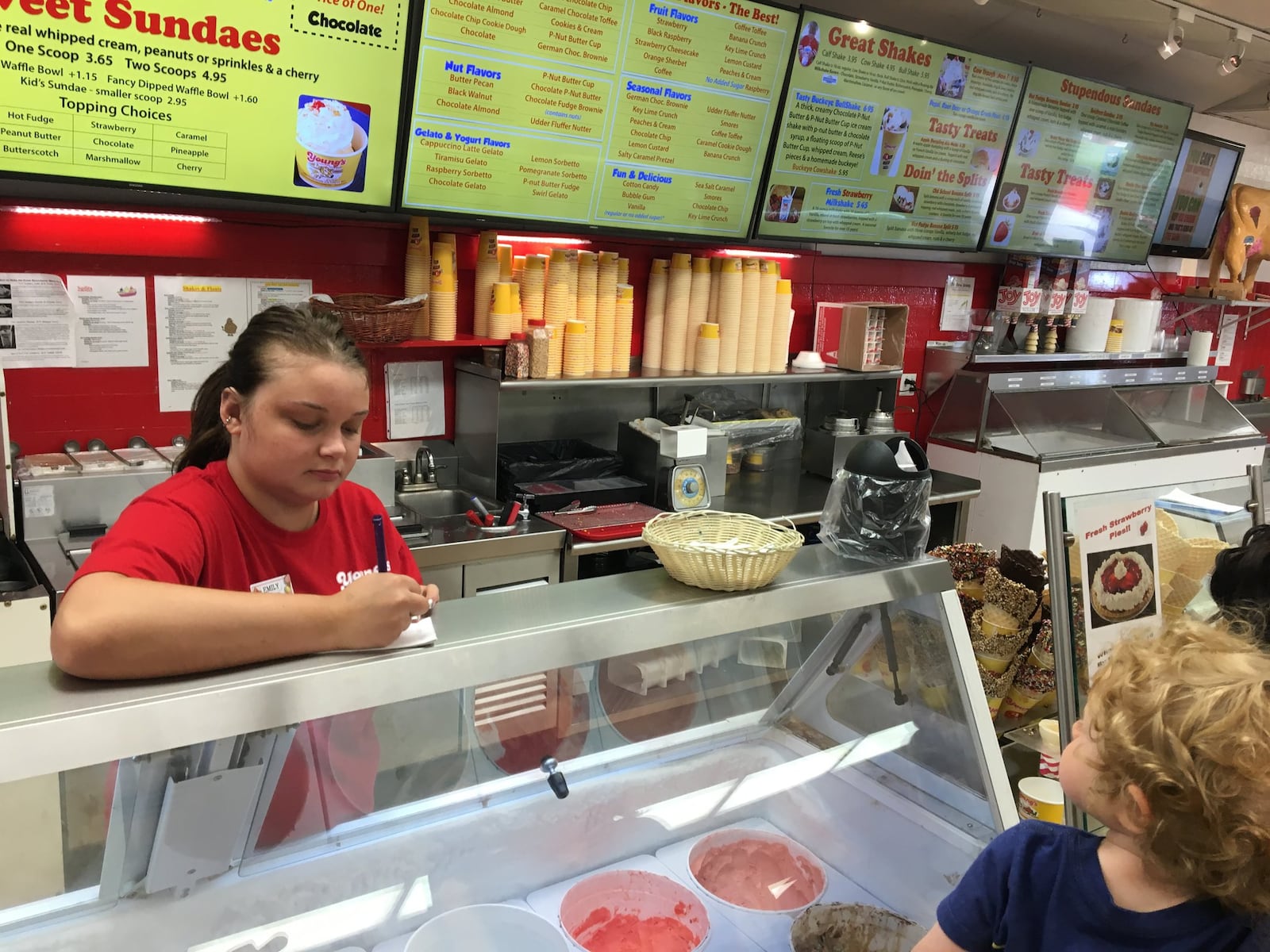 Emily Dyer of Springfield takes a customer order at Young’s Jersey Dairy. KARA DRISCOL/STAFF