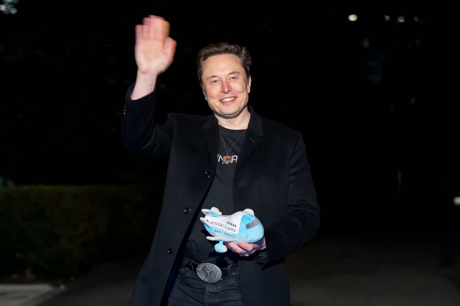 Elon Musk holds a stuffed Air Force One toy after arriving with President Donald Trump on Marine One on the South Lawn of the White House, Wednesday, Feb. 19, 2025, in Washington. (AP Photo/Alex Brandon)