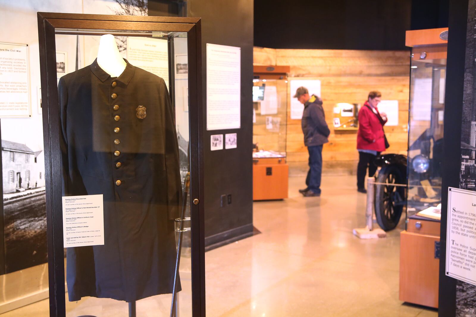 An early Dayton police officers uniform coat is among the artifacts in "Bootleggers, Bandits, and Badges: From Dry Times to Hard Times in Dayton, Ohio," on display at Carillon Historical Park. LISA POWELL / STAFF