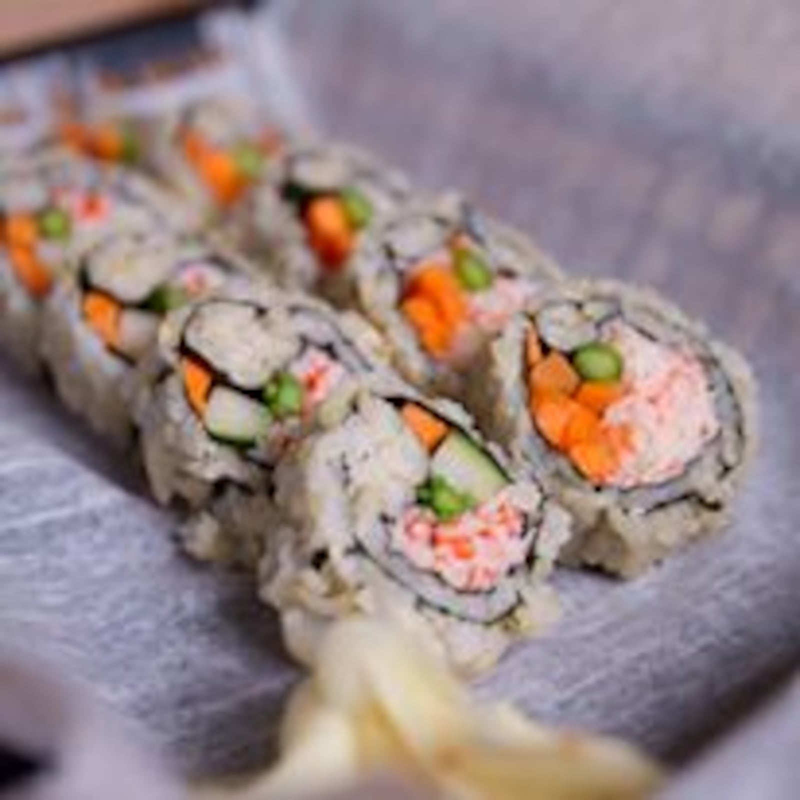 Create custom sushi rolls at Fusian.