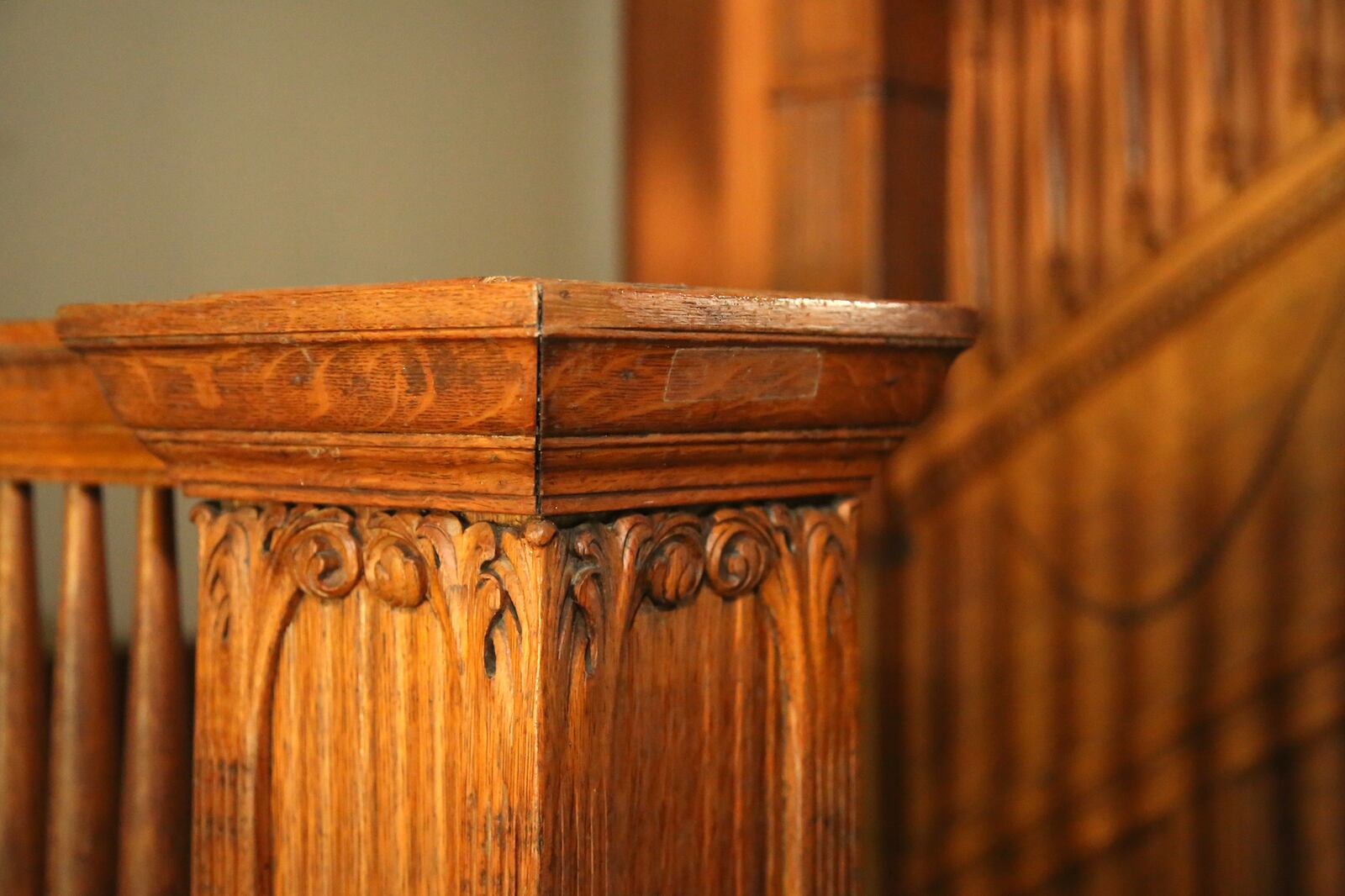 An ornately carved oak stairway takes leads visitors to the second floor of a historic home in the Dayton View Historic District known as the Cox Mansion. The owner does not have the recourses to renovate the home and has asked neighborhood leaders to find a new owner to give the home to.  LISA POWELL / STAFF