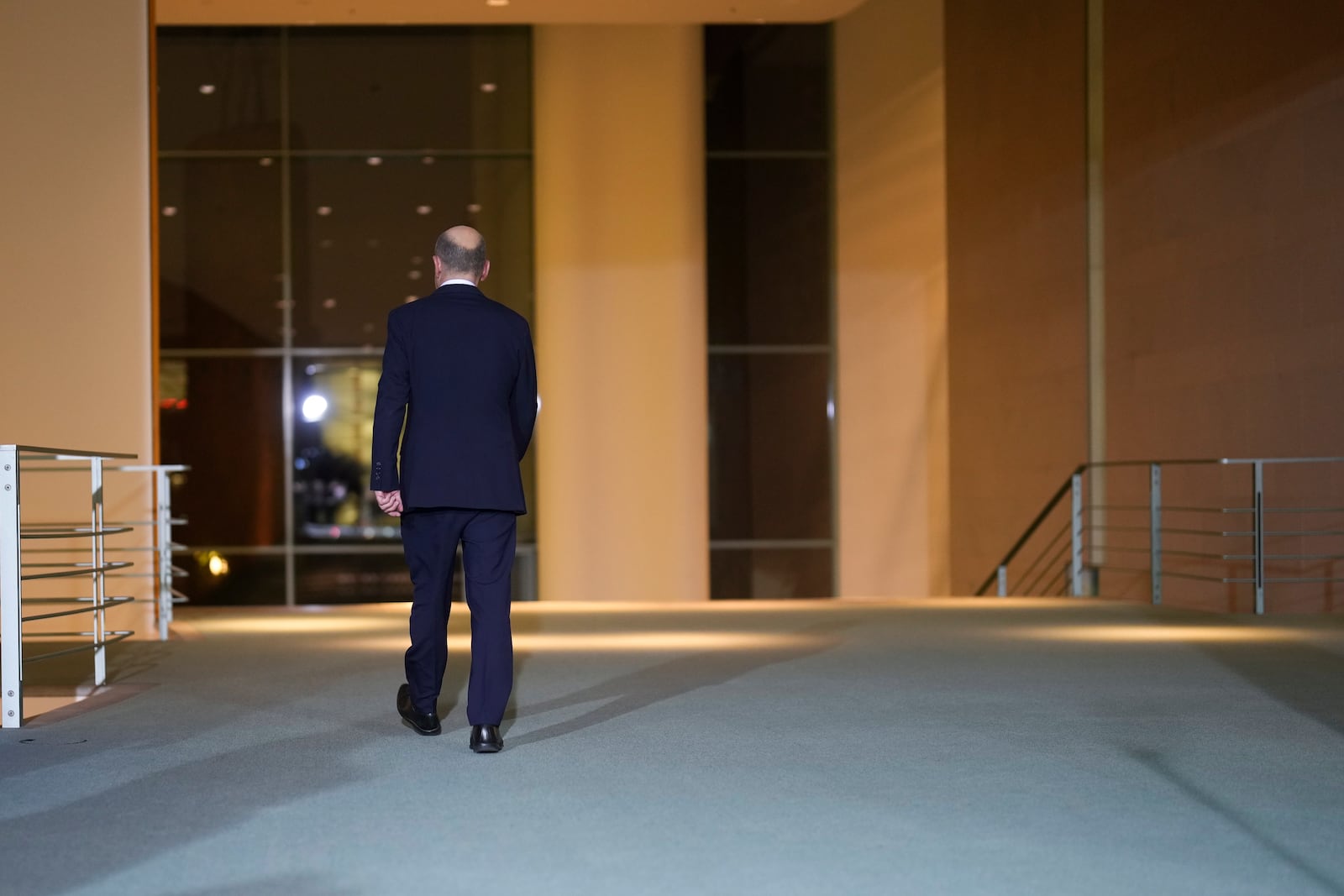 German Chancellor Olaf Scholz leaves a statement after a meeting with government leaders in Berlin, Germany, Wednesday, Nov. 6, 2024. (AP Photo/Markus Schreiber)