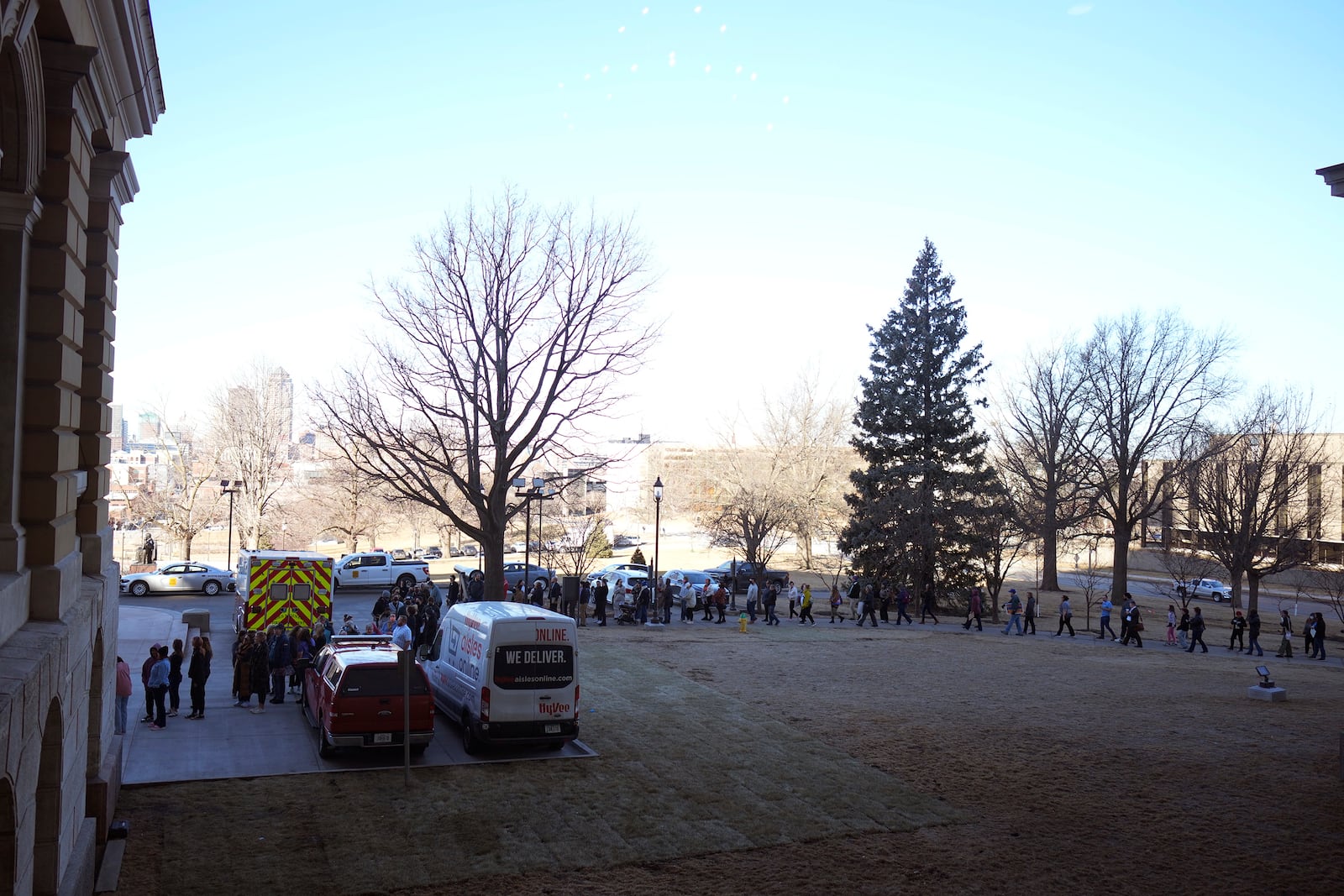 Protesters line up at the Iowa state Capitol in Des Moines to denounce a bill that would strip the state civil rights code of protections based on gender identity, Thursday, Feb. 27, 2025, in Des Moines, Iowa. (AP Photo/Charlie Neibergall)