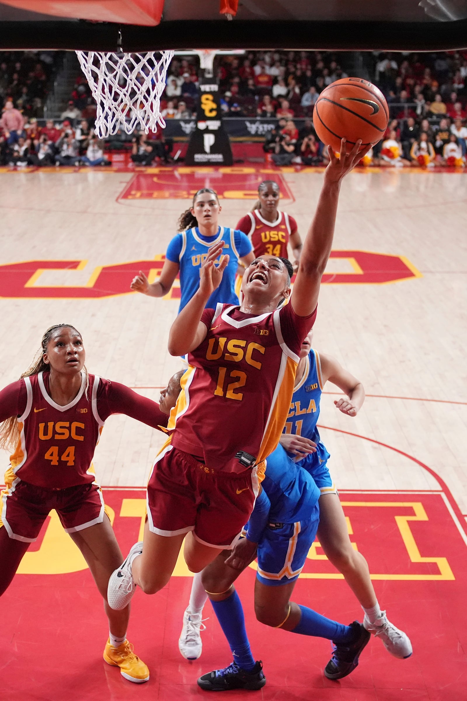 Southern California guard JuJu Watkins (12) shoots during the first half of an NCAA college basketball game against UCLA, Thursday, Feb. 13, 2025, in Los Angeles. (AP Photo/Mark J. Terrill)