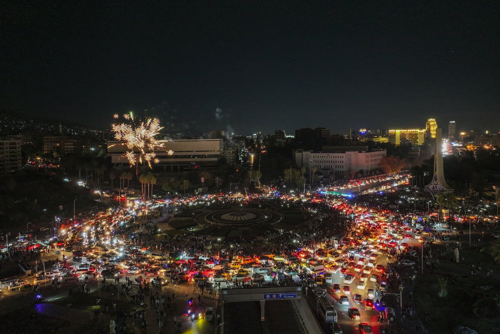 Fireworks explode over Umayyad square as celebrations continued into the night following the first Friday prayers since Bashar Assad's ouster, in Damascus, Syria, Friday, Dec. 13, 2024. (AP Photo/Ghaith Alsayed)