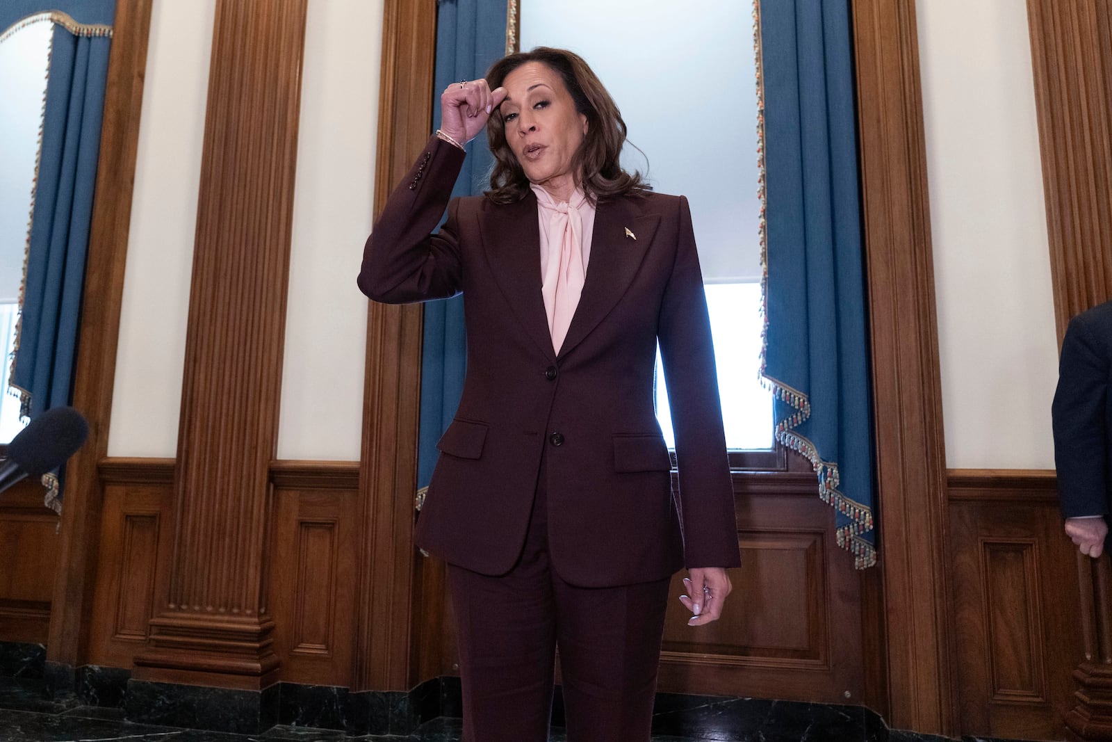 Vice President Kamala Harris talks to reporters after presiding over a joint session of Congress to confirm the Electoral College votes at the Capitol, Monday, Jan. 6, 2025, in Washington. (AP Photo/Jose Luis Magana)