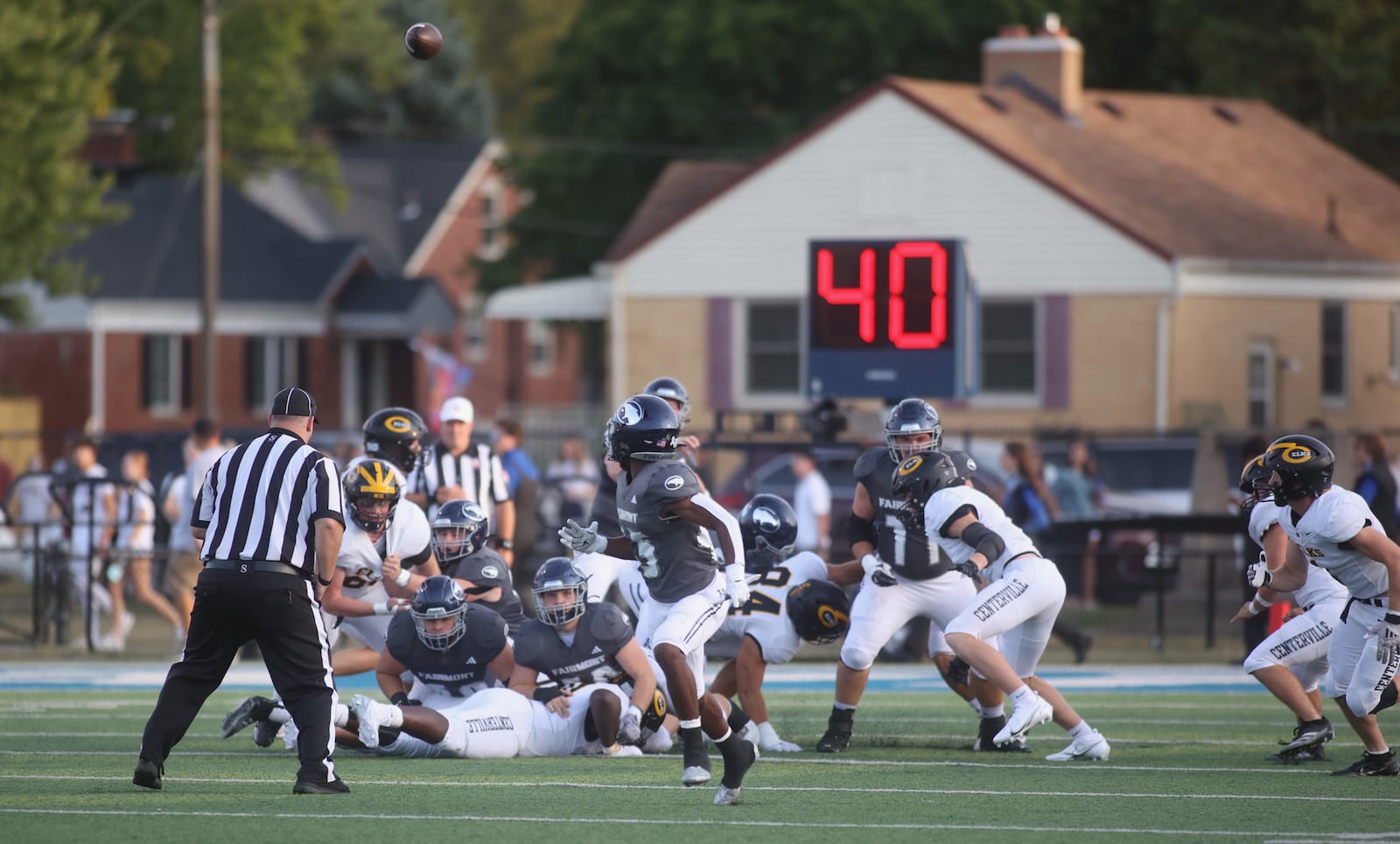 Fairmont's Brock Baker throws a touchdown pass against Centerville on Friday, Sept. 13, 2024, at Roush Stadium. David Jablonski/Staff