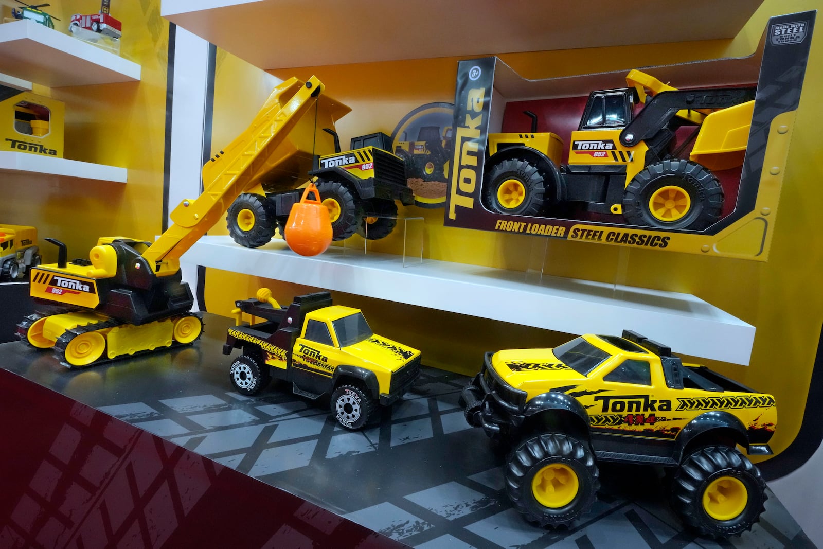 Tonka toys are displayed at the Toy Fair, in New York's Javits Center, Monday, March 3, 2025. (AP Photo/Richard Drew)